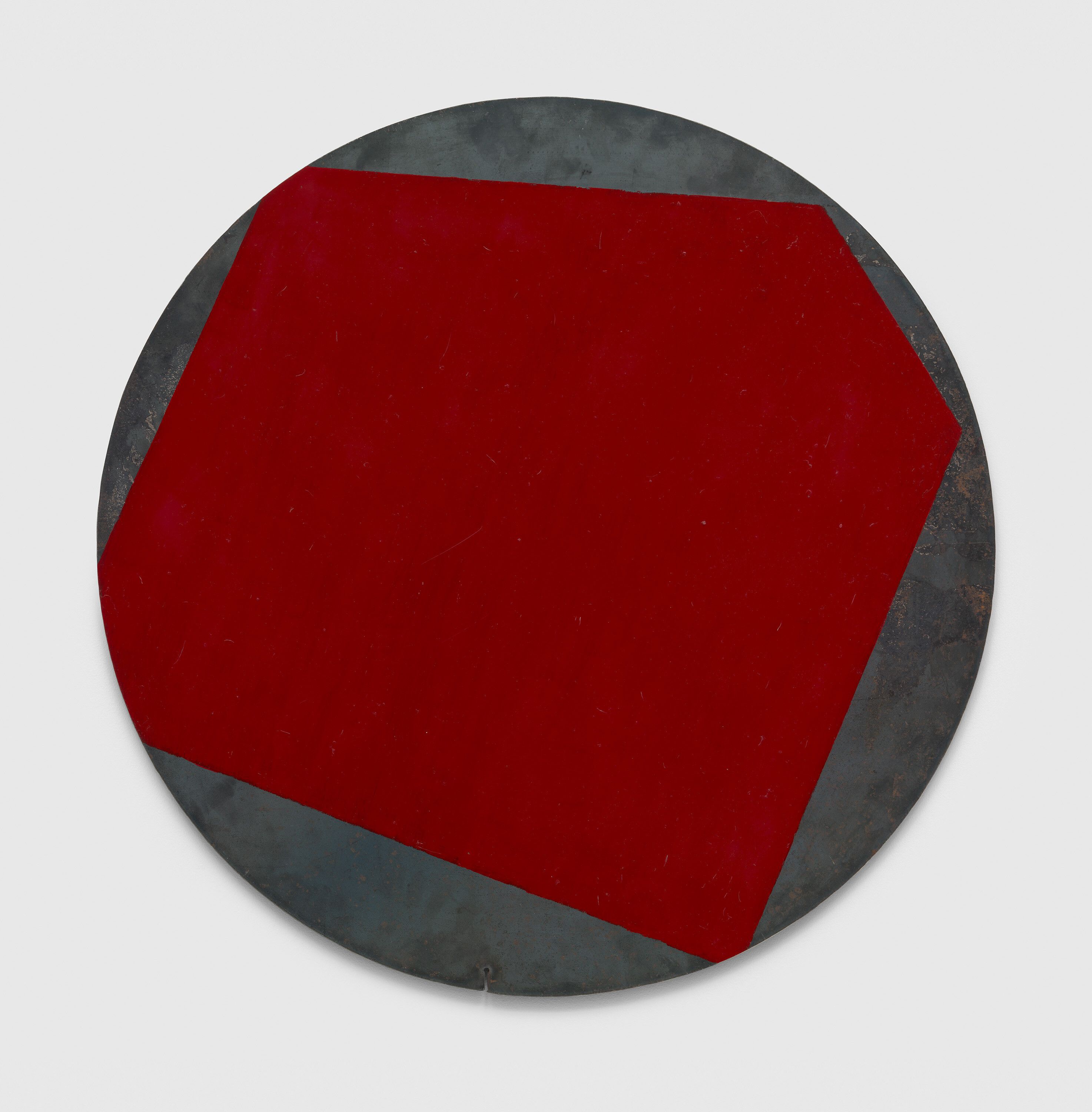 A painting on steel by Merrill Wagner, titled Red Circle, dated 1990.