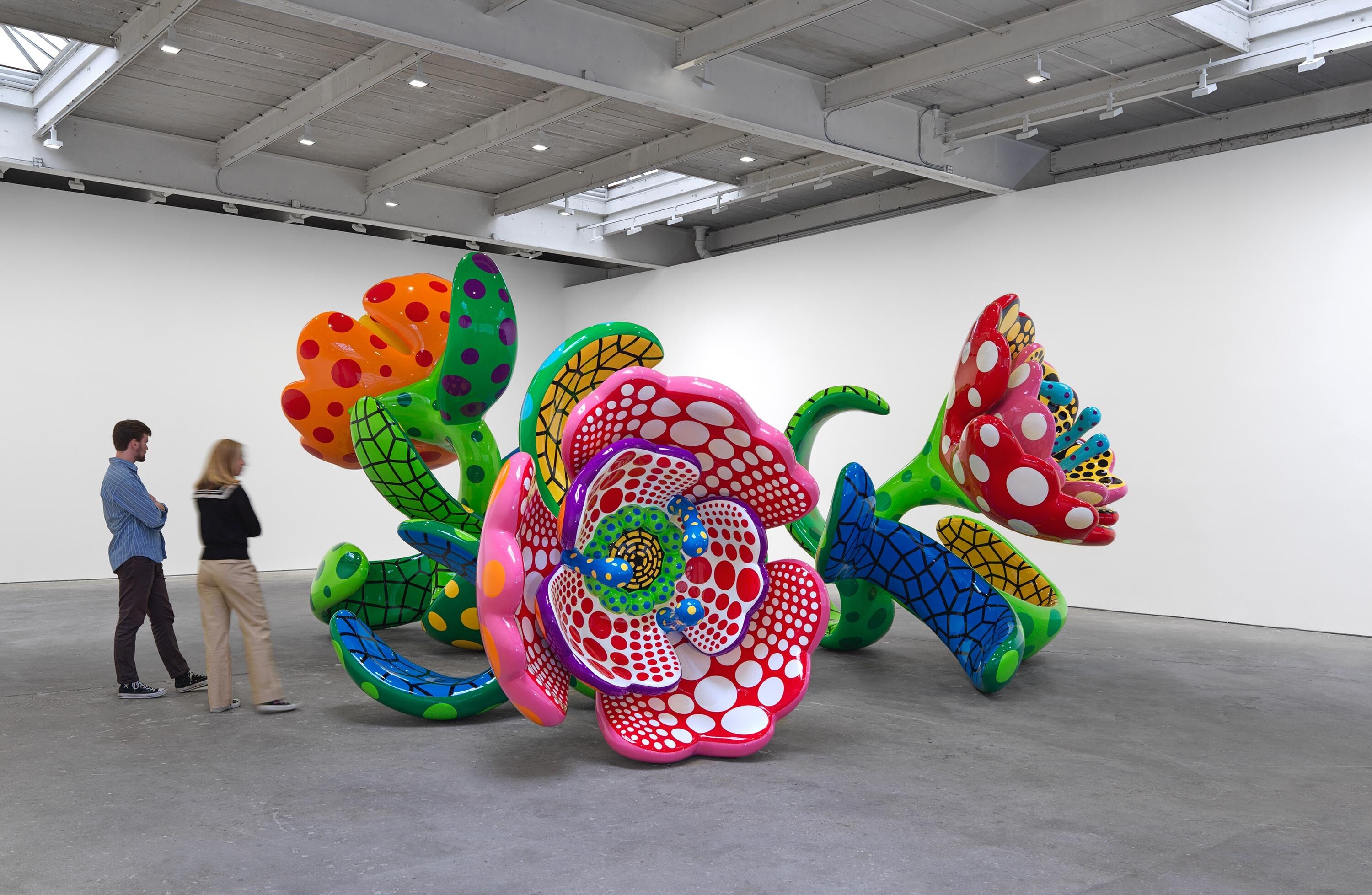 An installation view of the exhibition titled Yayoi Kusama, I Spend Each Day Embracing Flowers, dated 2023