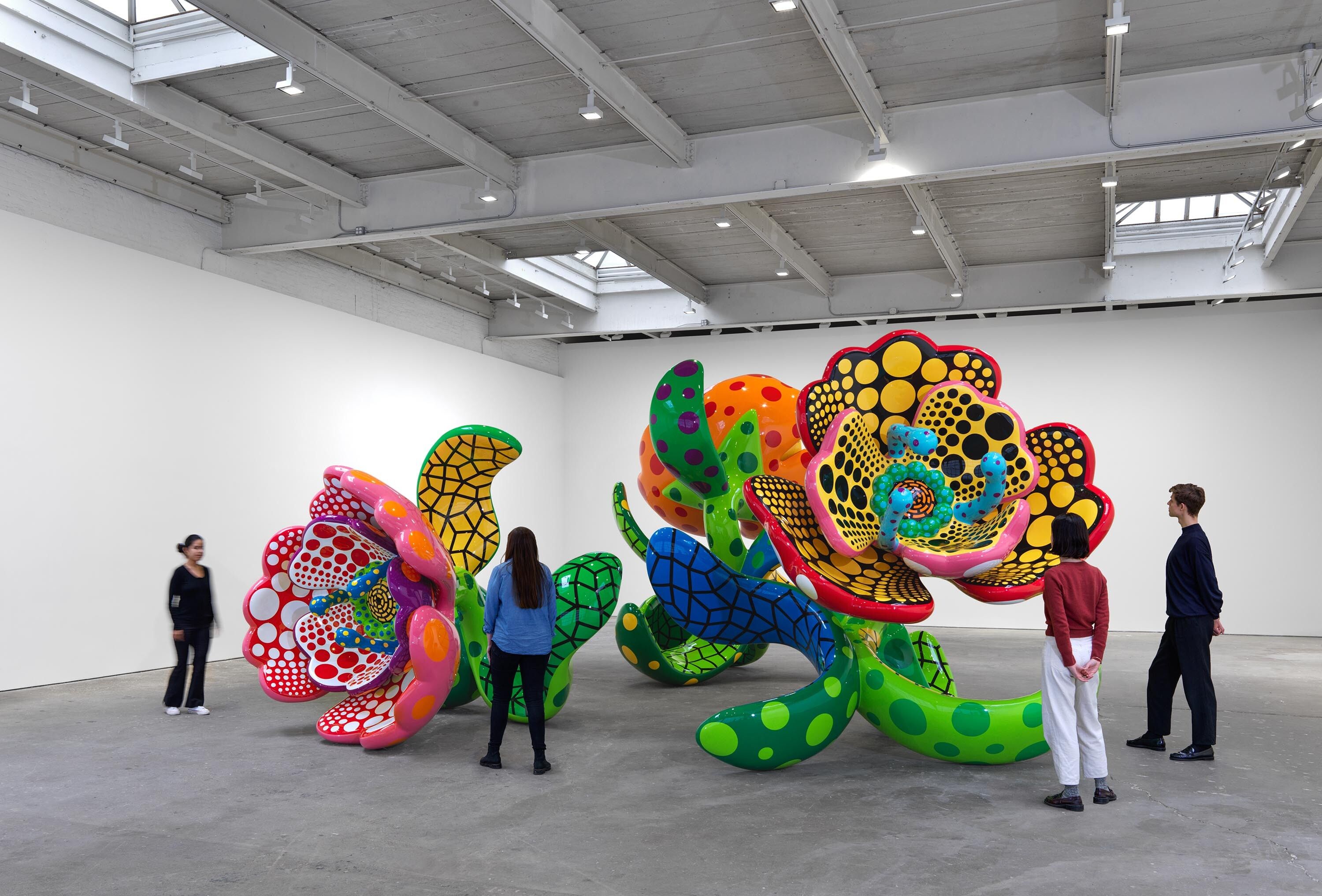 An installation view of the exhibition titled Yayoi Kusama, I Spend Each Day Embracing Flowers, dated 2023