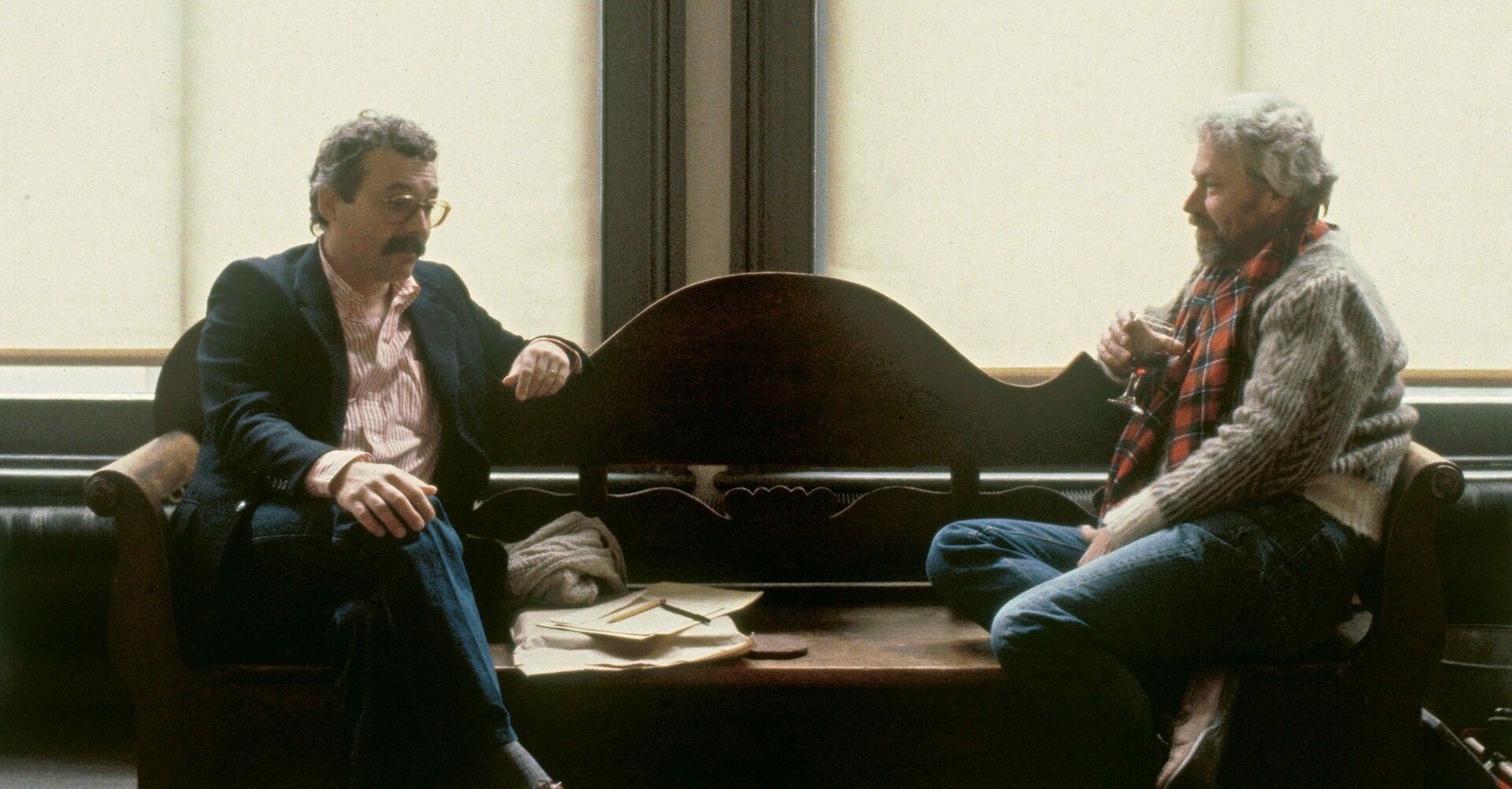 An image of two artists having a conversation