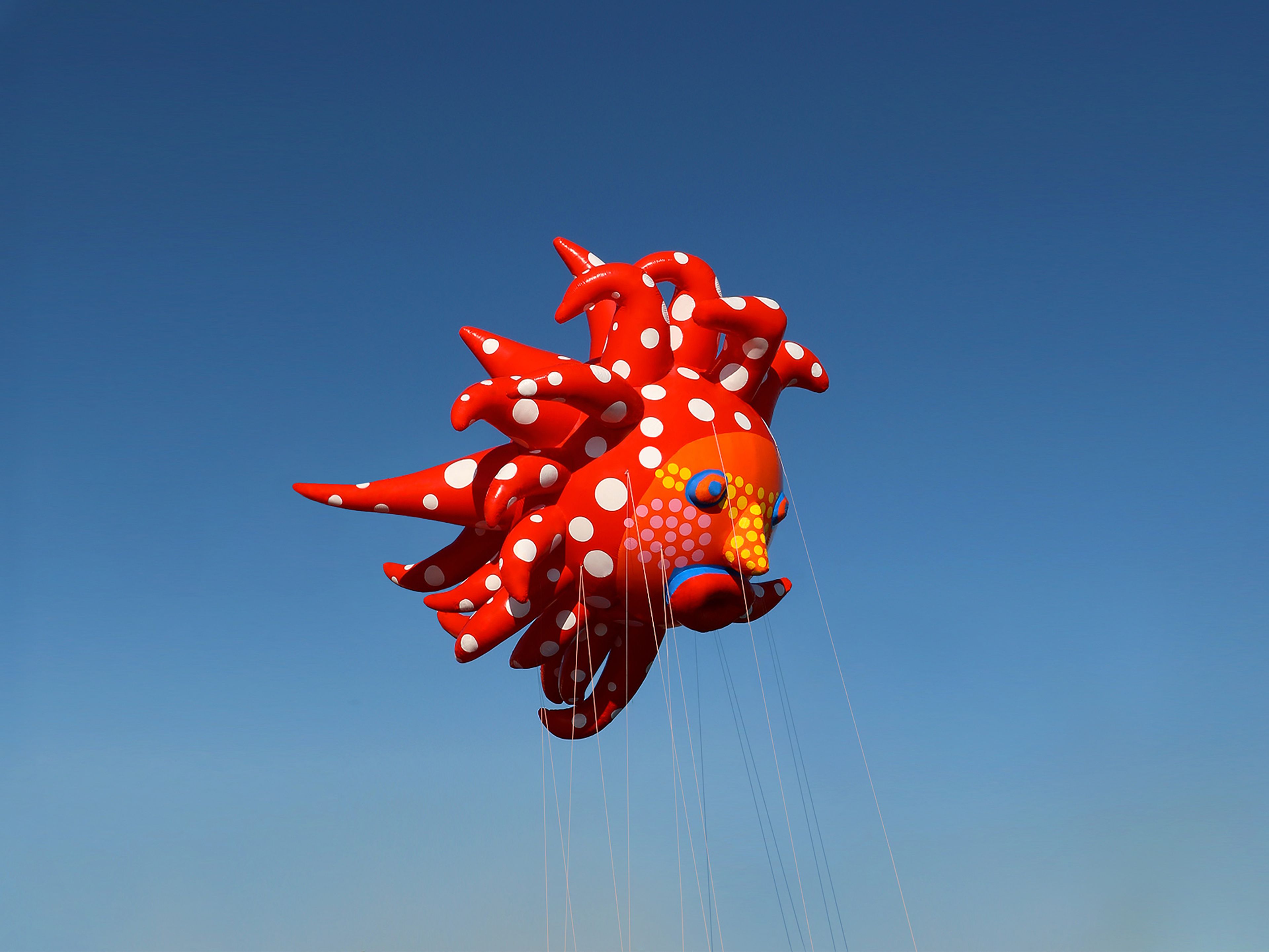 A photo of a balloon by Yayoi Kusama, titled Love Flies Up to the Sky, dated 2019.