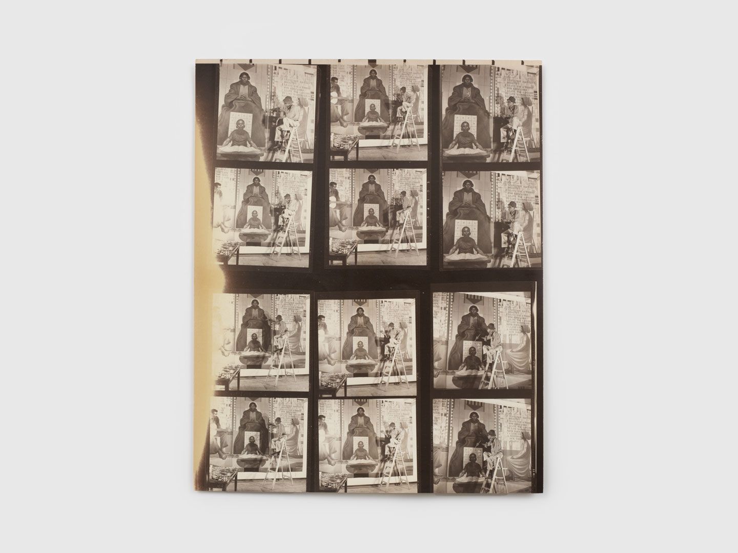 A photographic contact sheet comprised images of Charles White in front of Untitled (study for Mary McLeod Bethune mural), dated 1976. 