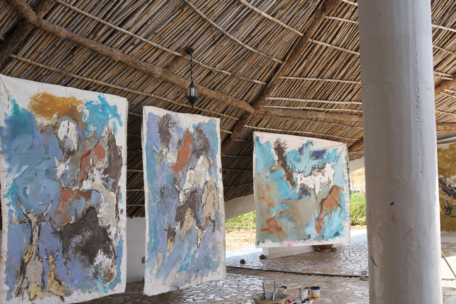 A photograph of paintings by Oumar Ball, dated 2016.