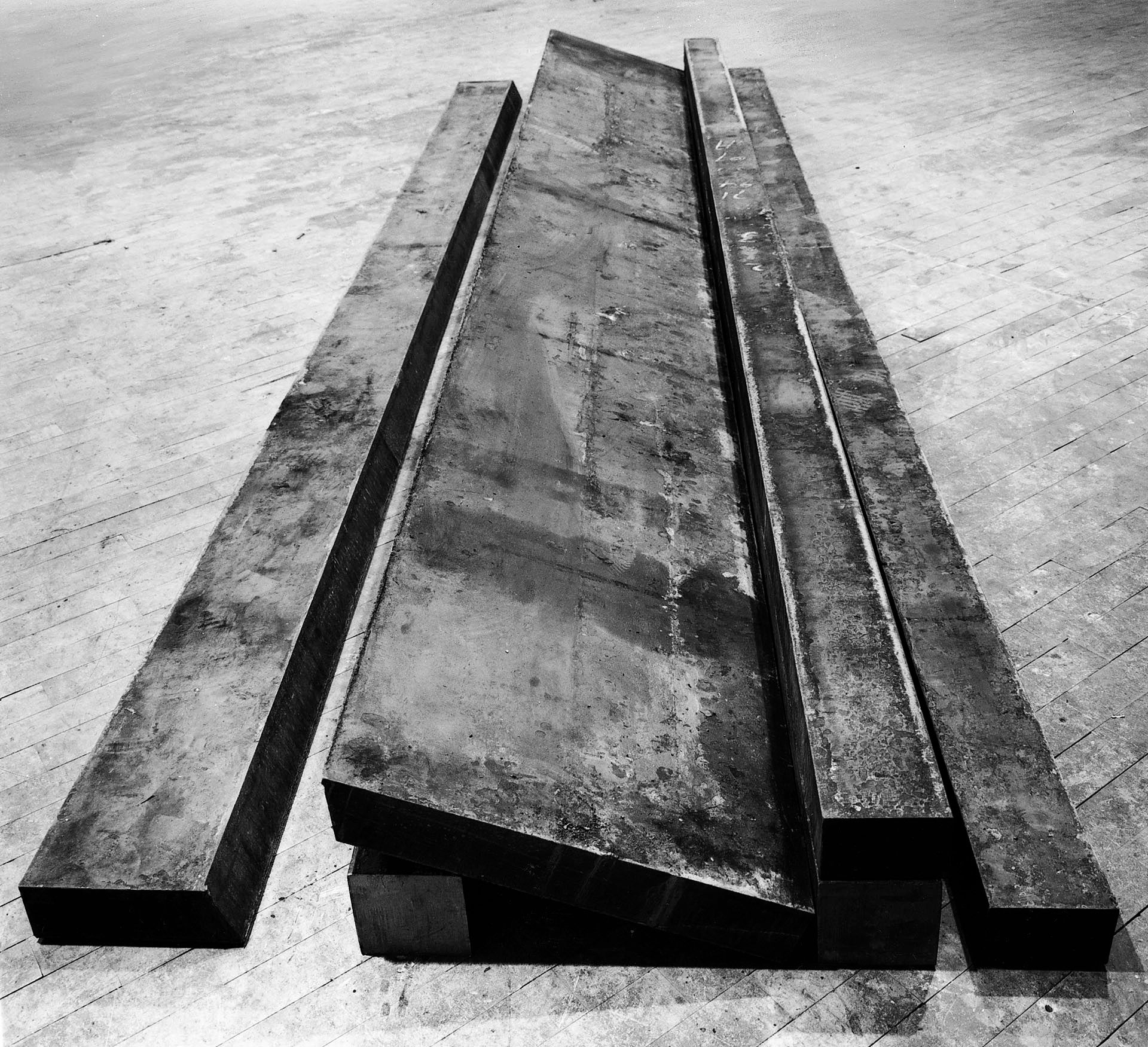 A hot-rolled steel sculpture by Richard Serra, titled Three Cuts, dated 1971.