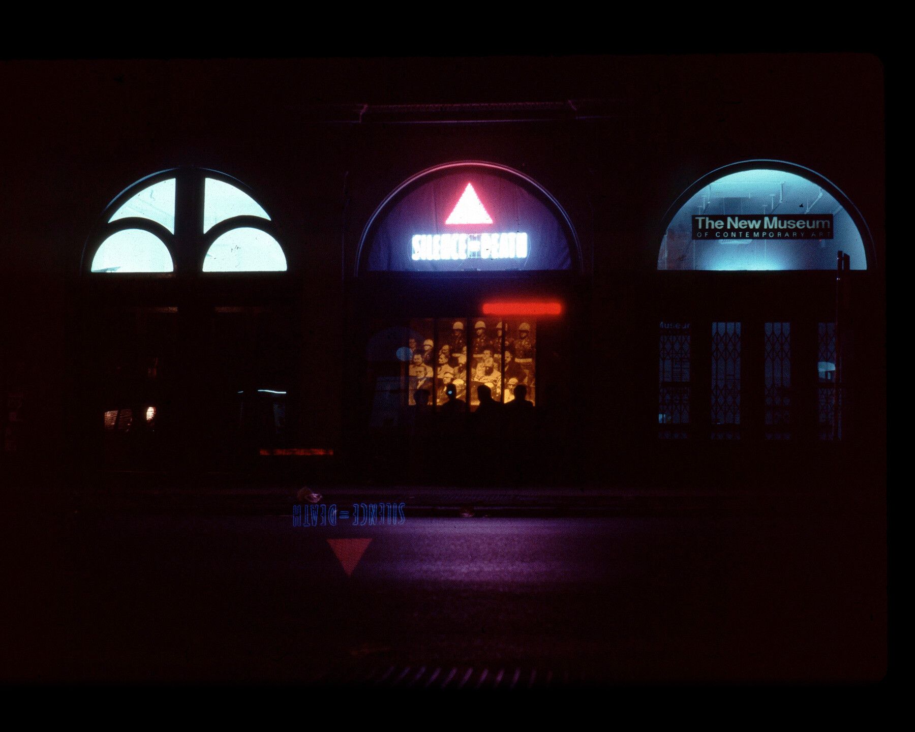 A photo of a Silence=Death neon installation at the New Museum in New York for the exhibition "Let the record show", in 1987.
