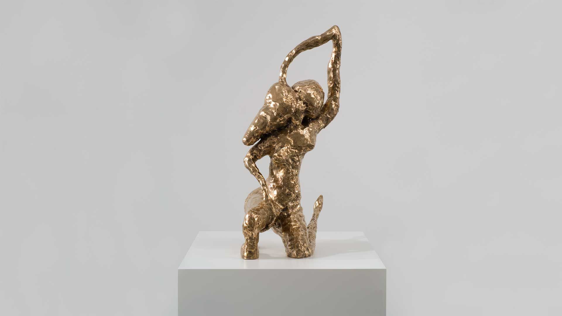 A bronze sculpture by Chris Ofili, titled Genuflect, dated 2006.