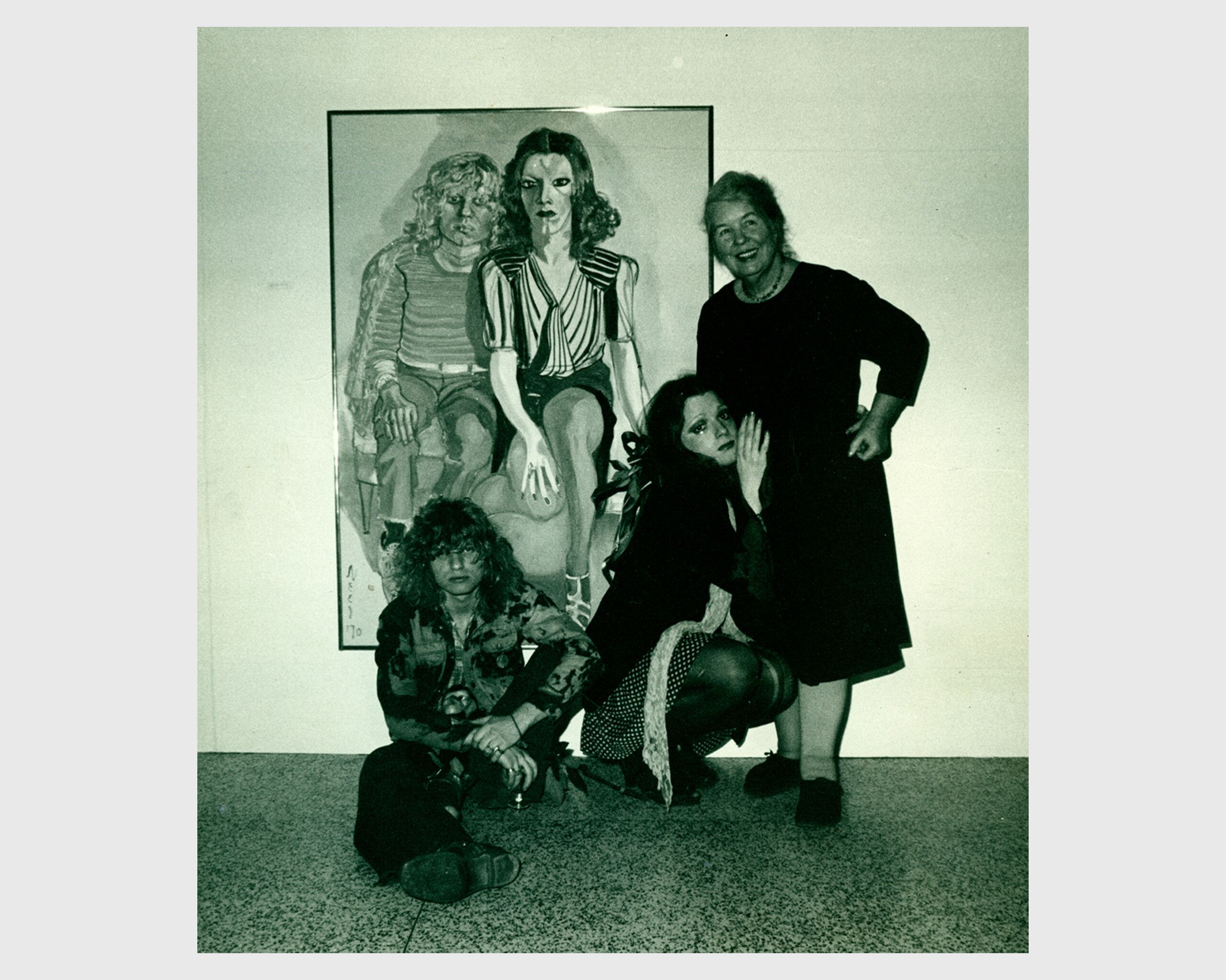 A photo of Alice Neel with Ritta Redd and Jackie Curtis and their portrait, at Moore College Show, dated 1971