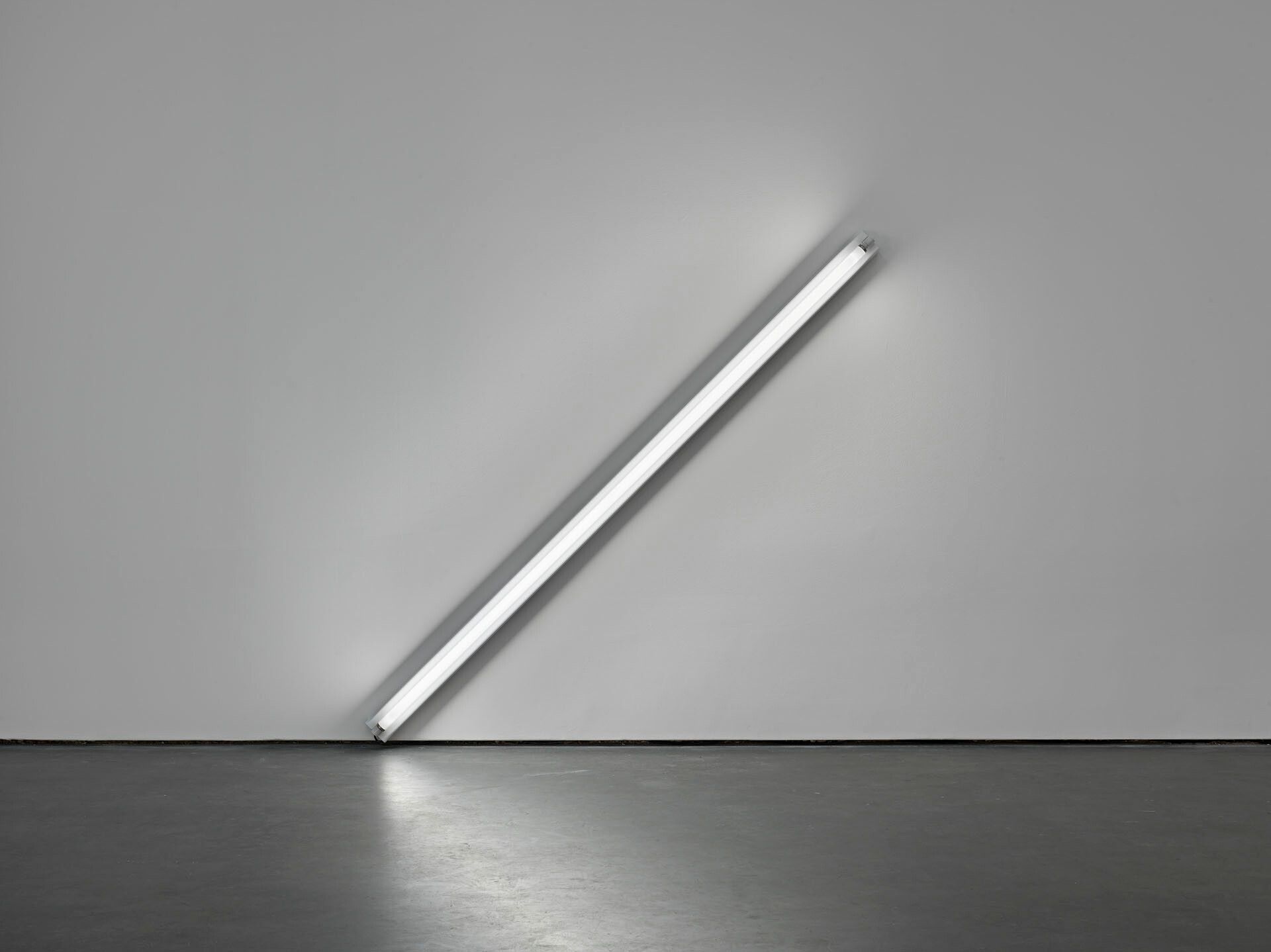 A sculpture by Dan Flavin, composed of soft white fluorescent light, titled the diagonal of May 25, 1693, dated 1963.