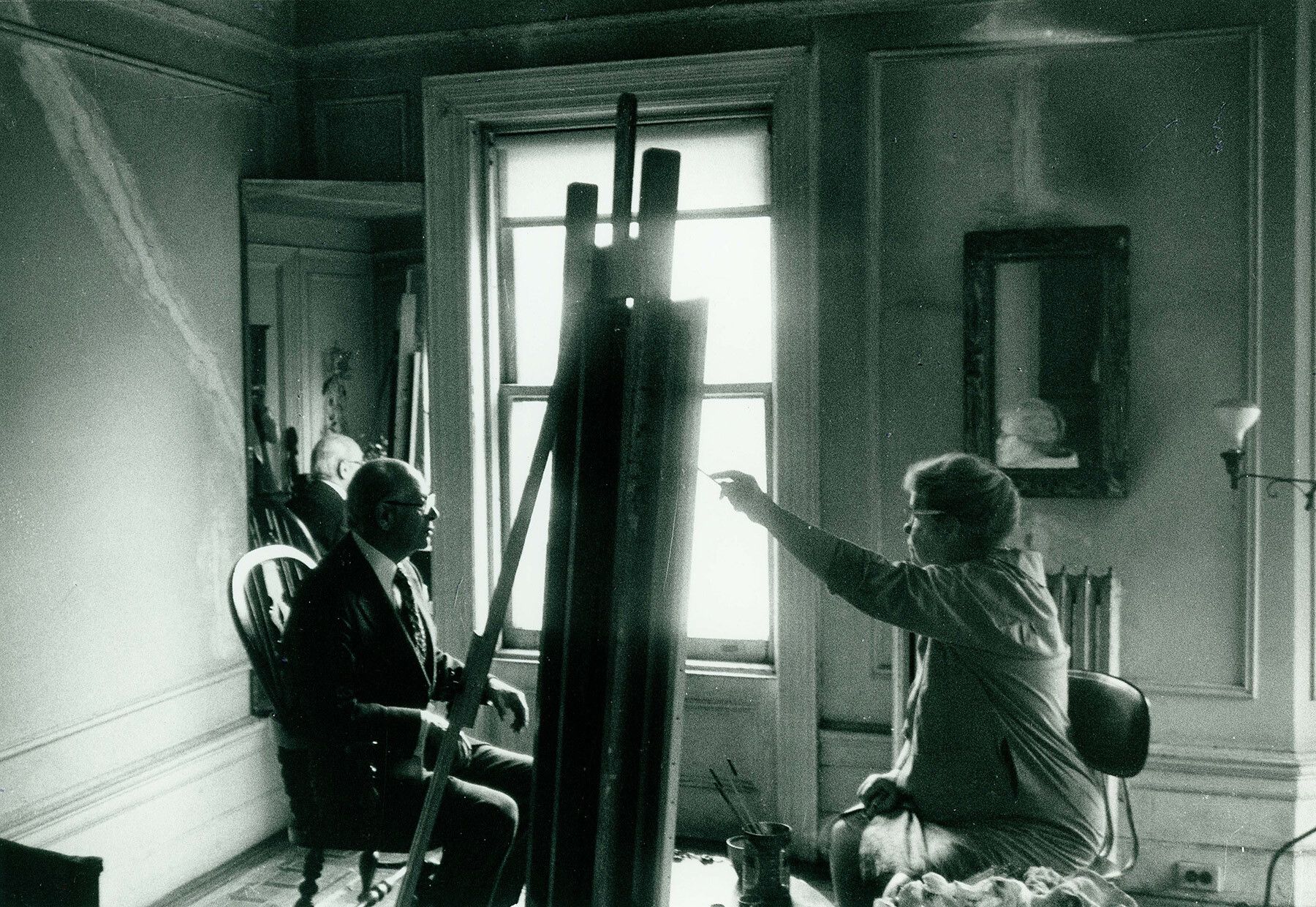 A photo of Alice Neel working in her apartment at 300 West 107th Street, New York