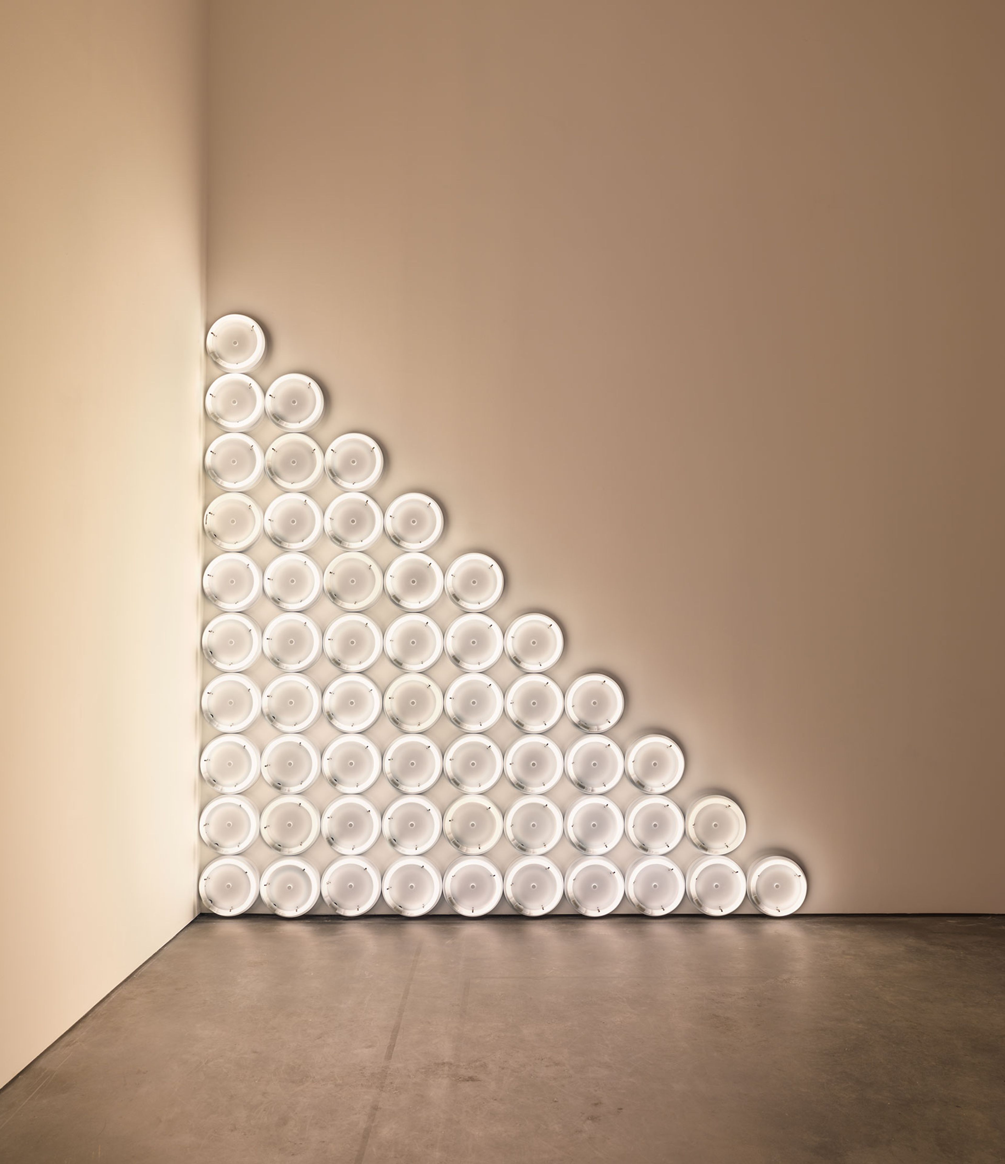 A corner sculpture in warm white fluorescent light by Dan Flavin, titled untitled (to a man, George McGovern) 2, dated 1972