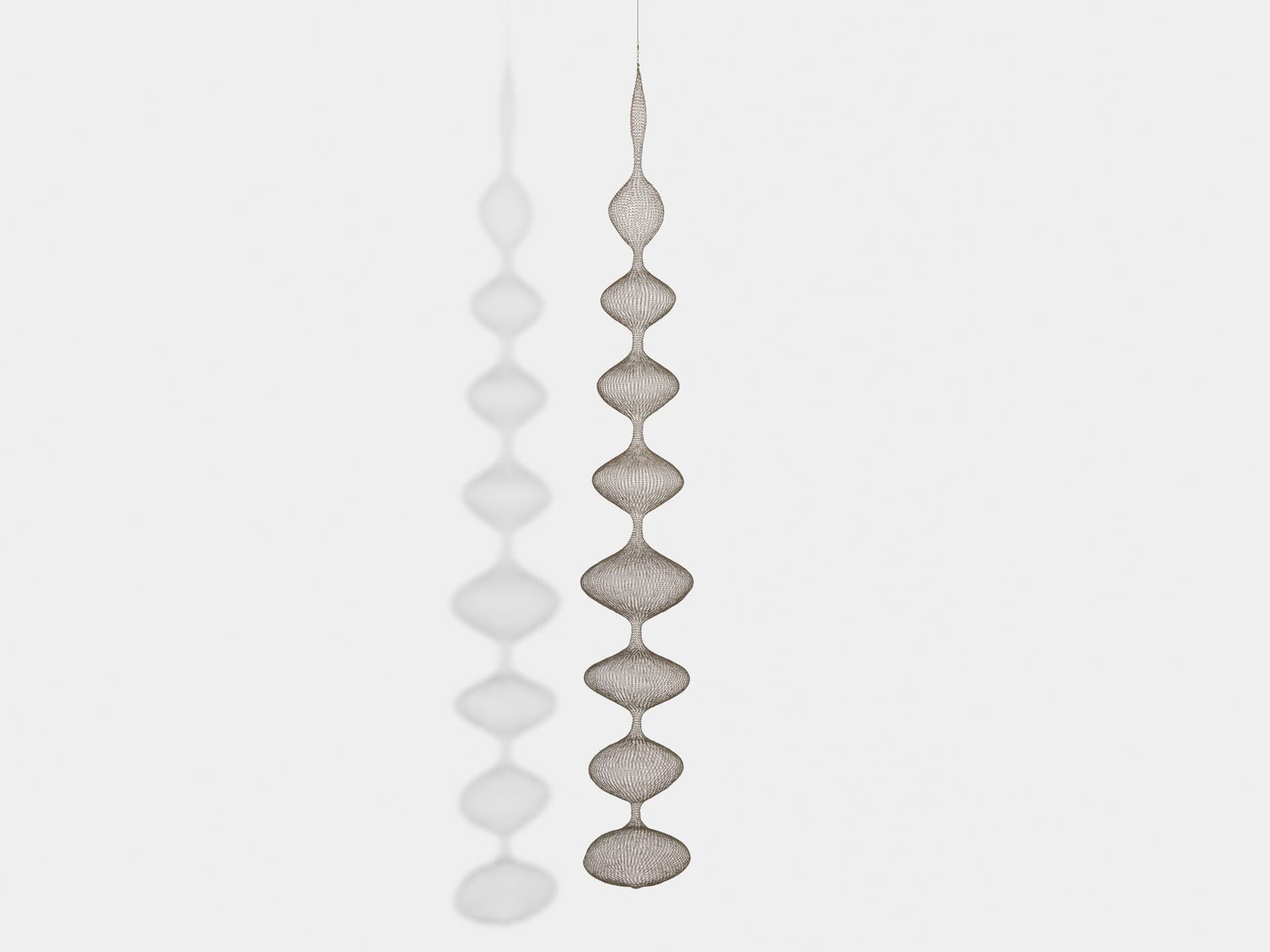 A sculpture by Ruth Asawa, titled Untitled (S.154, Hanging Nine-Lobed, Single-Layered Continuous Form), dated circa 1952.