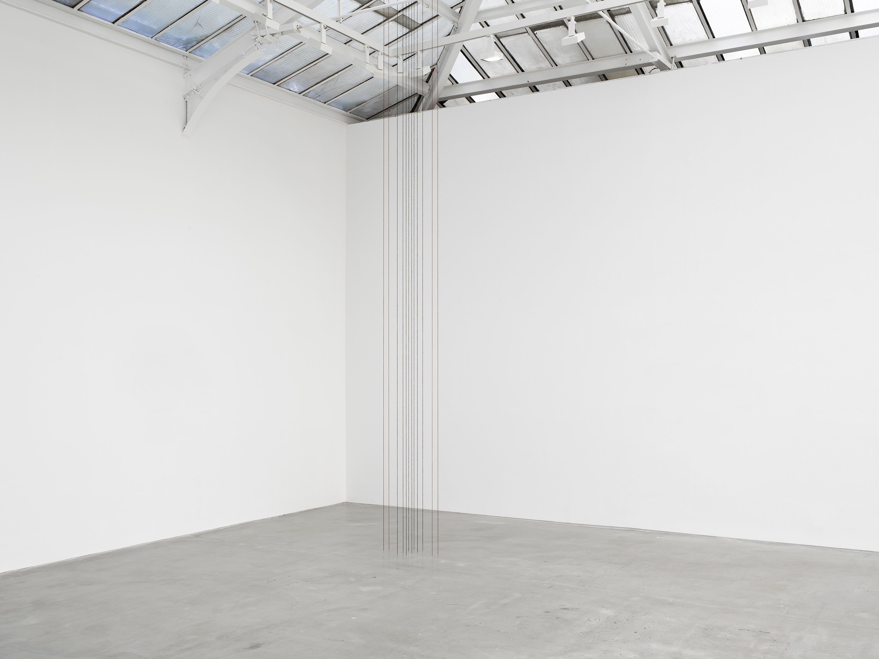 A sculptural installation by Fred Sandback, titled Untitled (Sculptural Study, Twelve-part Vertical Construction), dated 1989 and 2022.