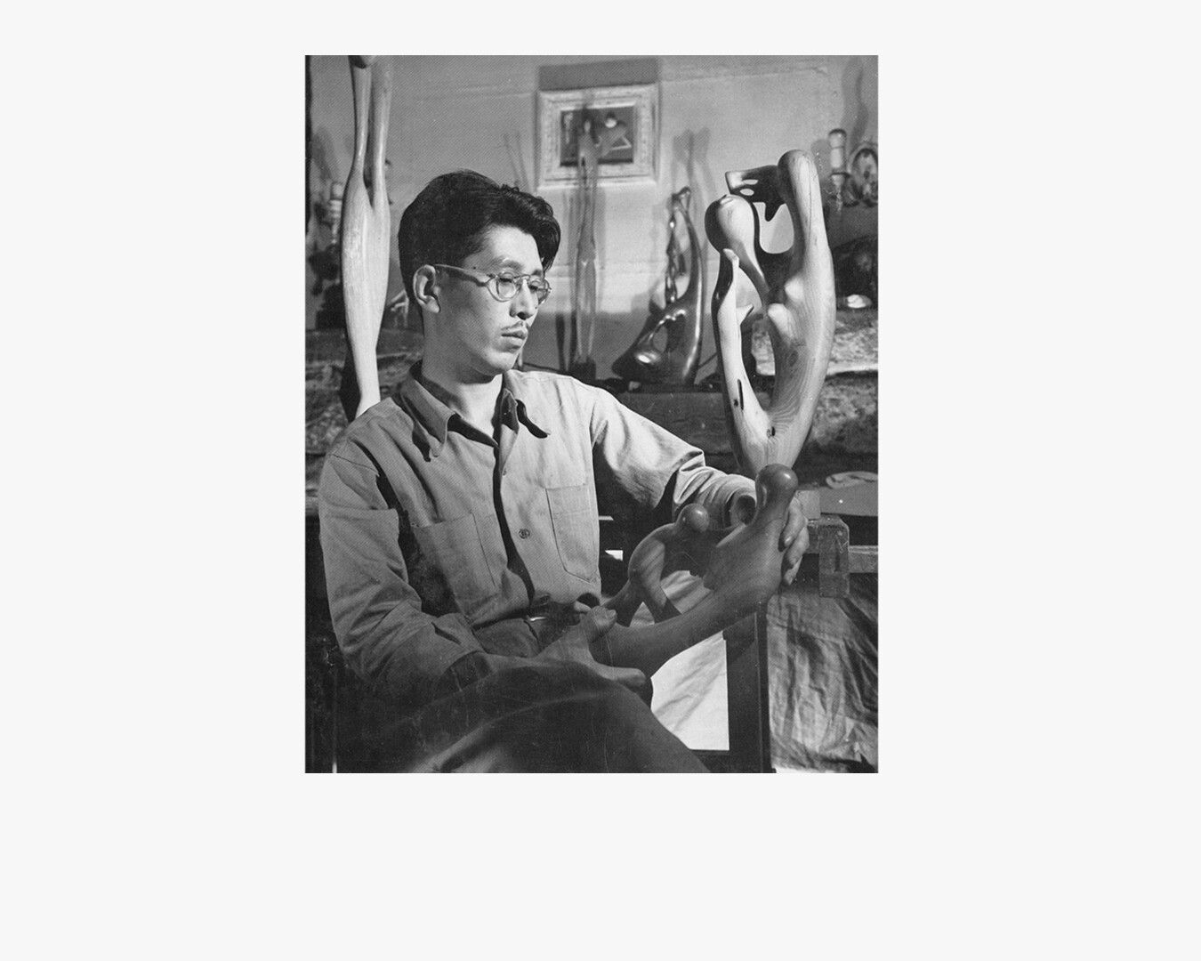 A photo of Leo Amino in his Perry Street apartment studio, dated 1946.
