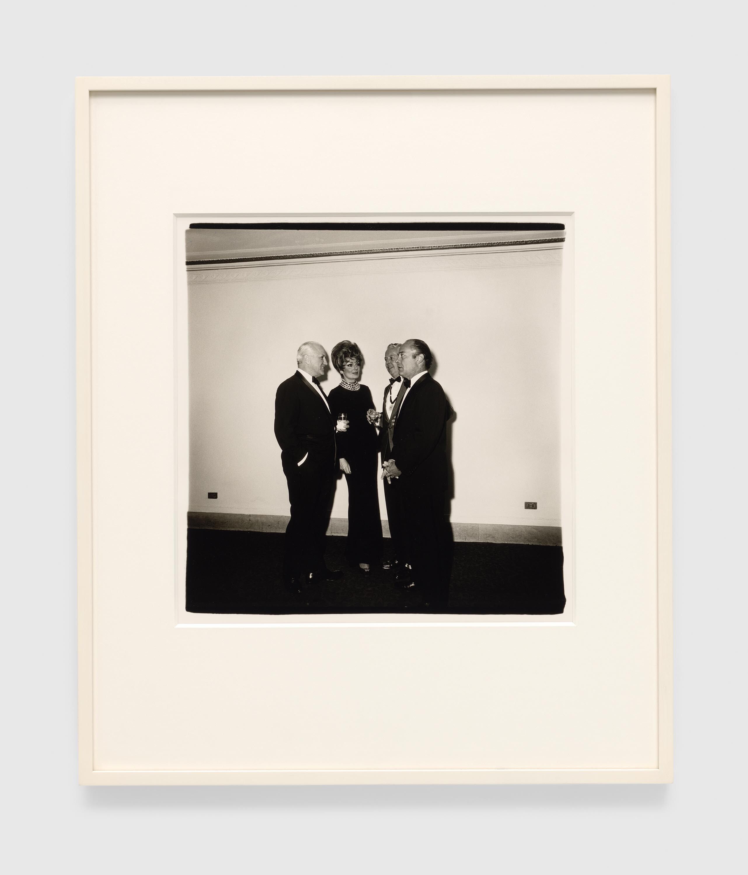 A gelatin silver print by Diane Arbus, titled Four people at a gallery opening, N.Y.C. 1968, dated 1968.