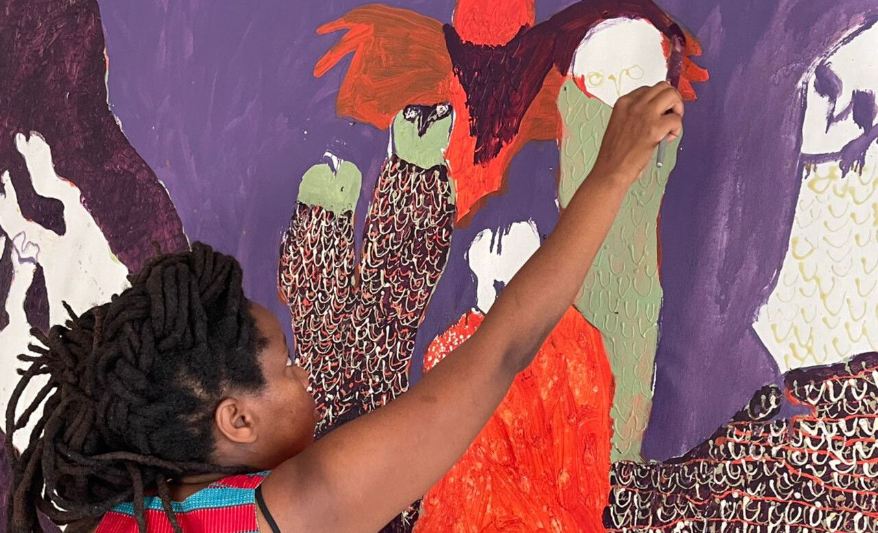 A photo of Portia Zvavahera in her studio, Harare, Zimbabwe, in 2021.