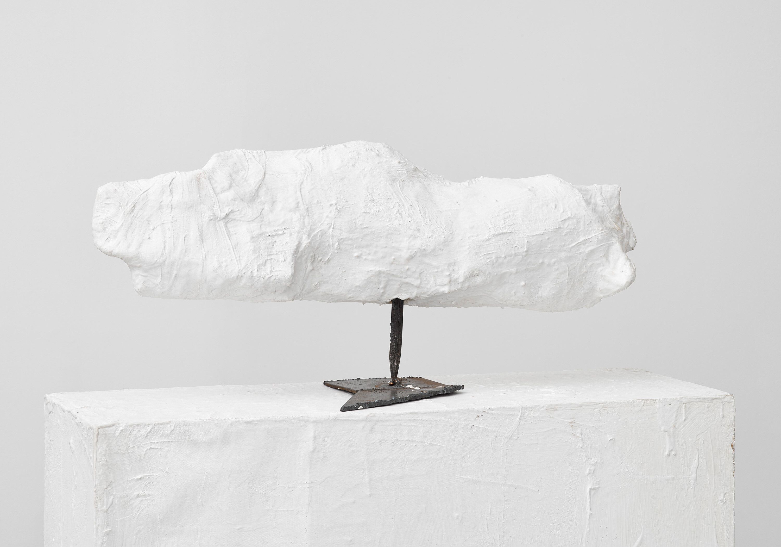 A plaster, papier-mâché, and metal stand with artist's pedestal sculpture by Franz West, titled Passstück (Adaptive), dated 1990.