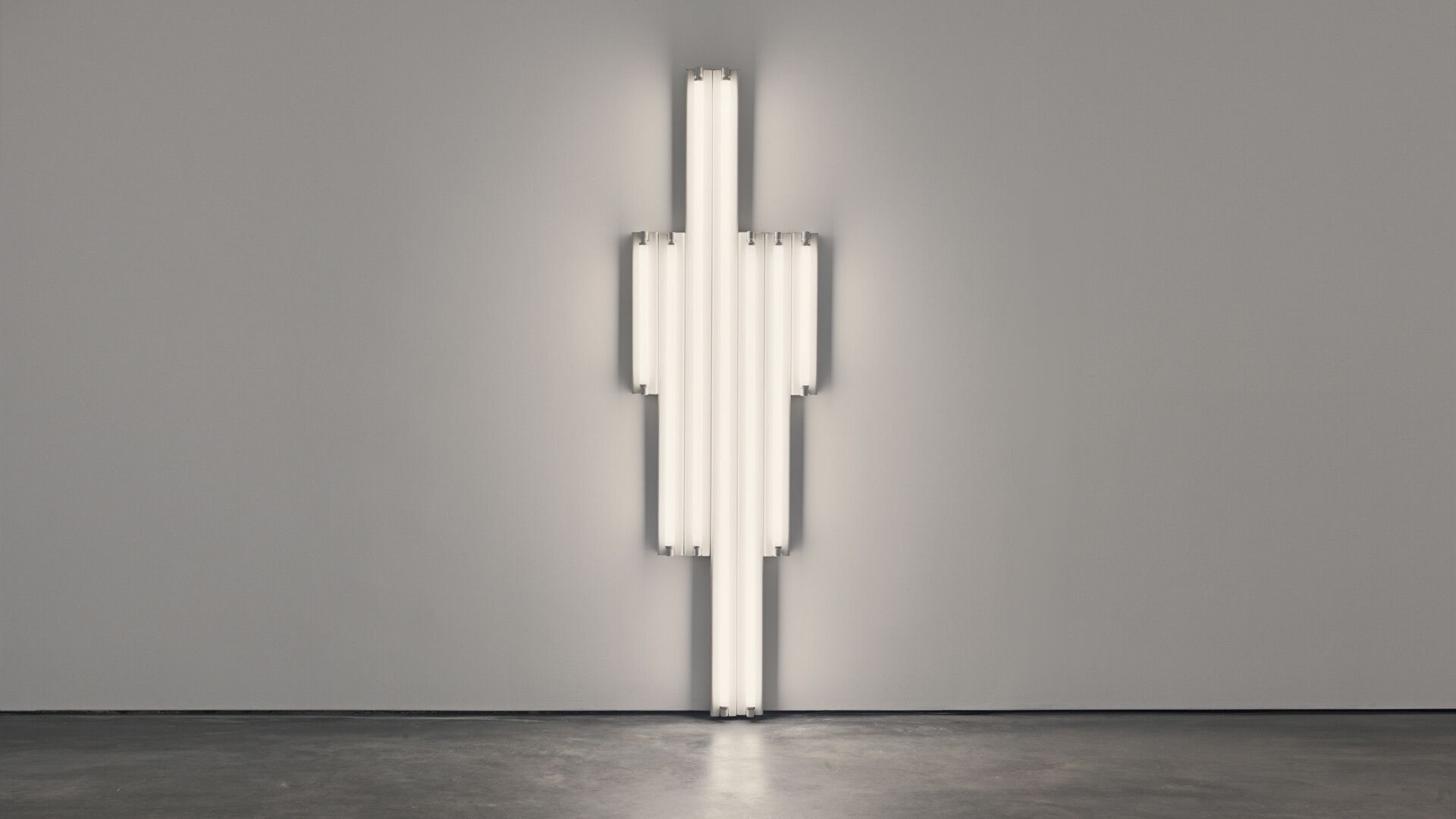 A cool white fluorescent light sculpture by Dan Flavin, titled "monument" for V. Tatlin, dated 1964.
