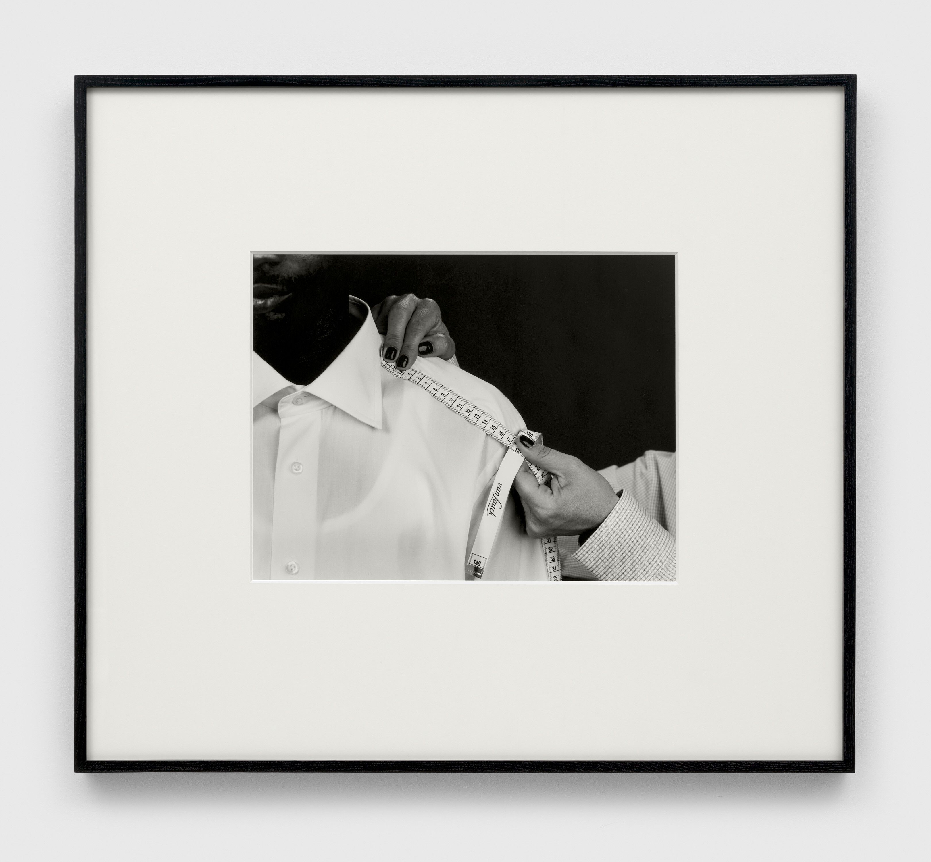 A photograph by Christopher Williams, titled Natürlich bekommen Sie für den Preis eines van Laack Hemdes zwei andere. Of course, for the price of one van Laack shirt, you can get two others. Dirk Schaper Studio, Berlin, July 20th, 2007, dated 2008.