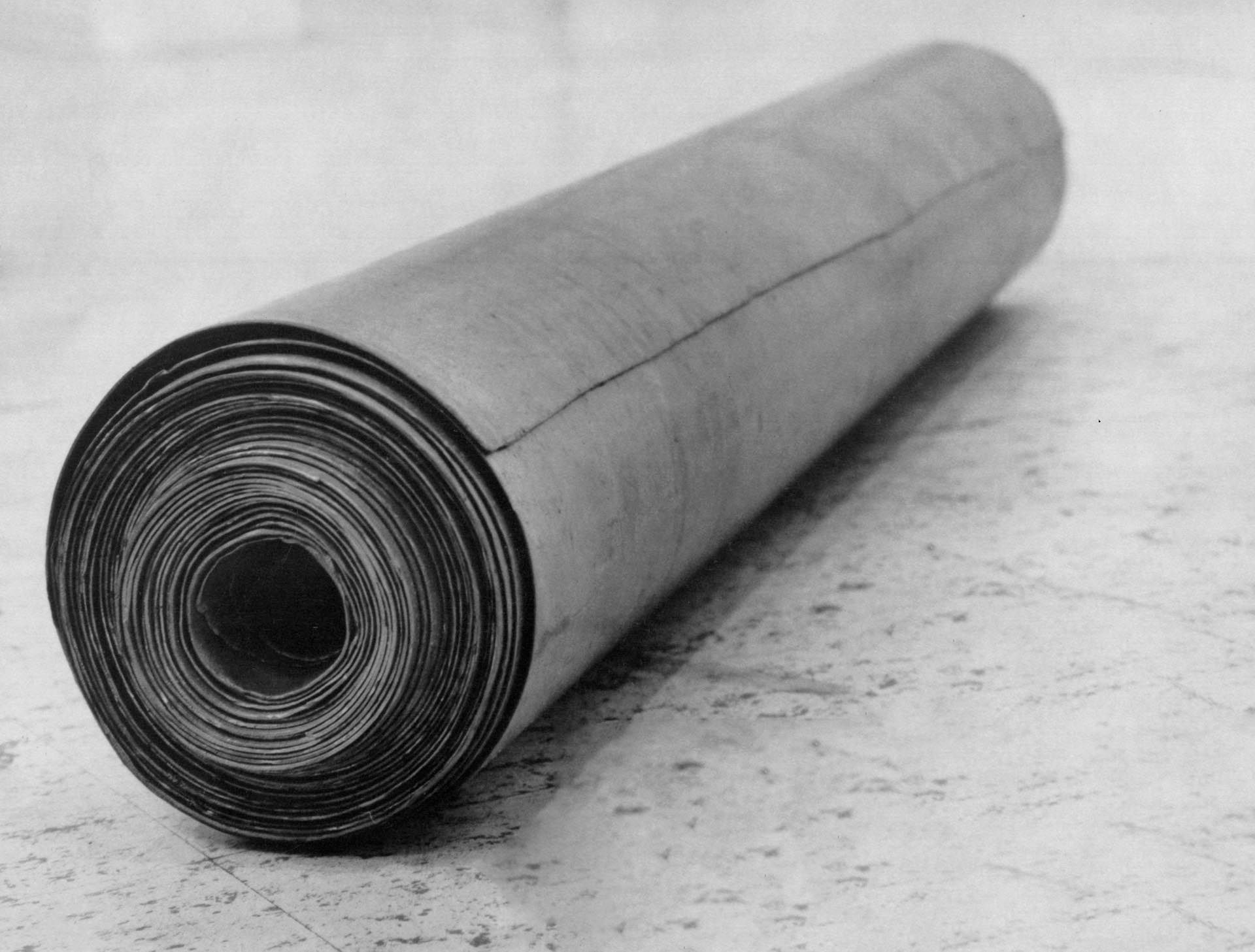 A lead sculpture by Richard Serra, titled Thirty-five Feet of Lead Rolled Up, dated 1968.