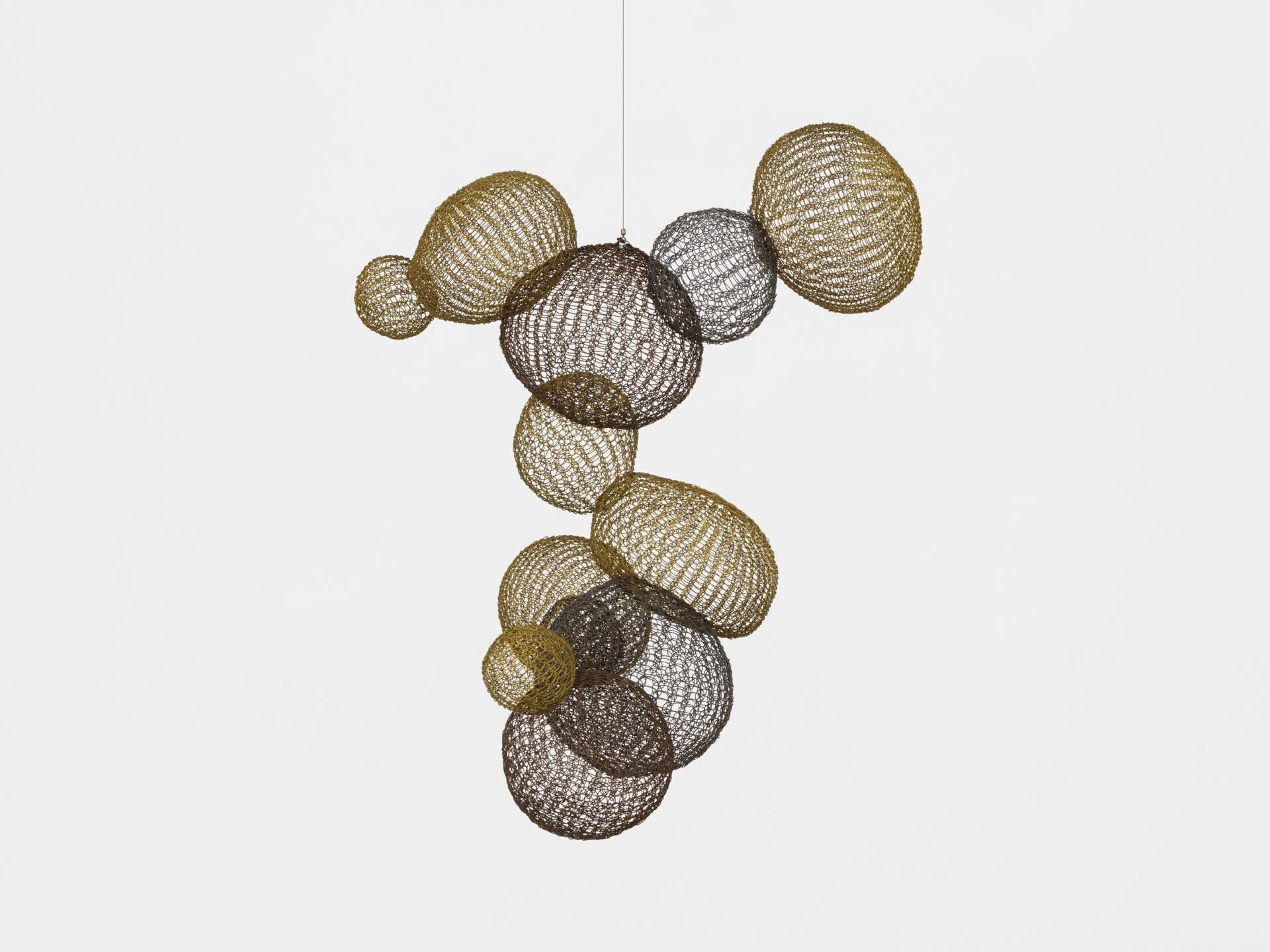 A sculpture by Ruth Asawa, titled Untitled (S.089, Hanging Asymmetrical Twelve Interlocked Bubbles), dated circa 1958.