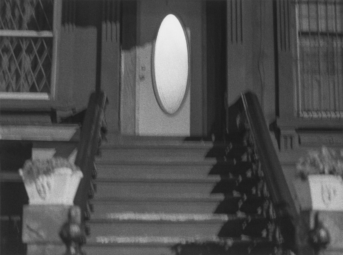A silver gelatin print by Roy DeCarava, titled Oval door, dated 1999.