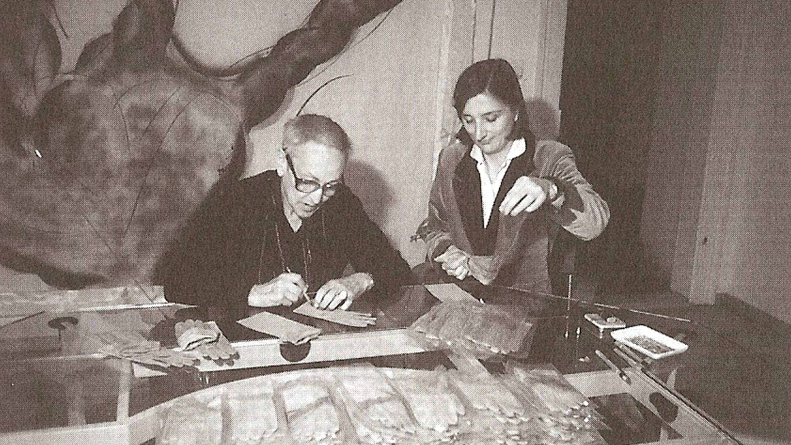 Oppenheim signing her finished glove edition. 