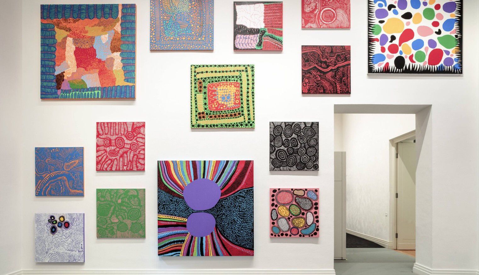 An installation view of an exhibition titled Yayoi Kusama: A Retrospective – A Bouquet of Love I Saw in the Universe, at Gropius Bau in Berlin in 2021.