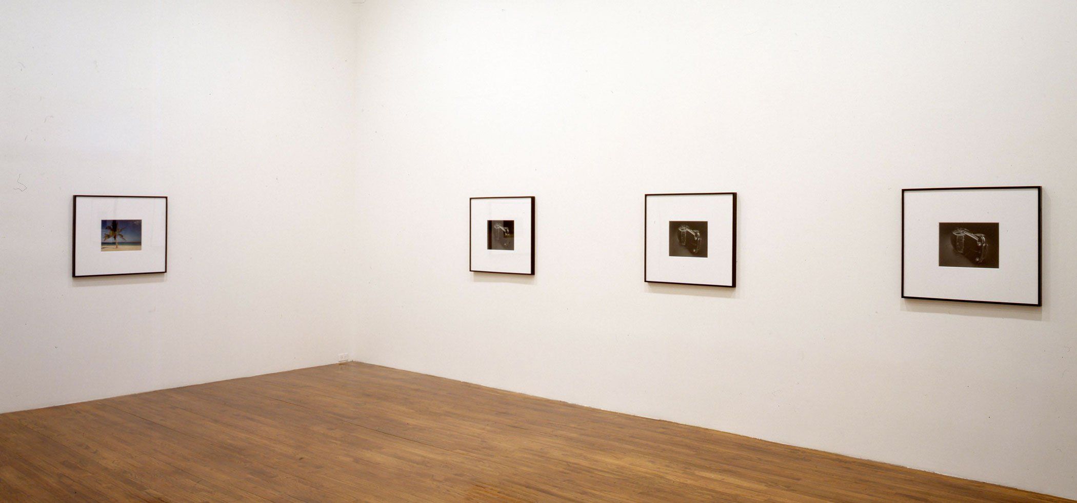 An installation view of the exhibition Christopher Williams: For Example: Die Welt ist schön (Revision 17) Couleur Européenne, Couleur Soviétique, Couleur Chinoise, at David Zwirner New York, dated 2000.