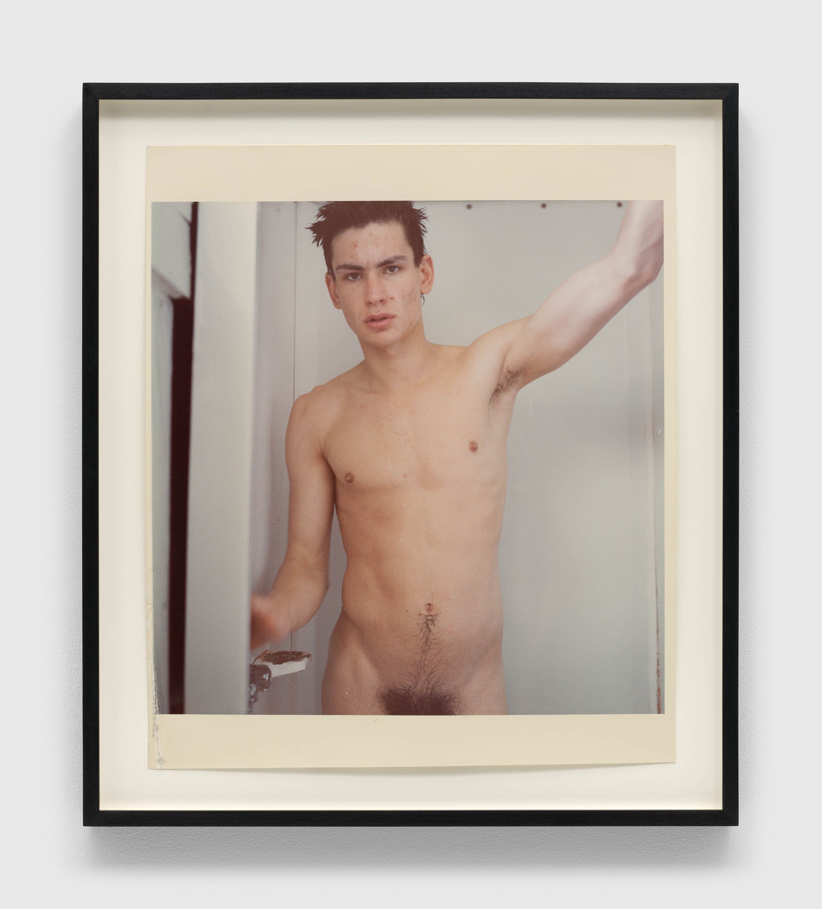 A photograph by Mark Morrisroe, titled Untitled (self-portrait standing in the shower), dated 1981.
