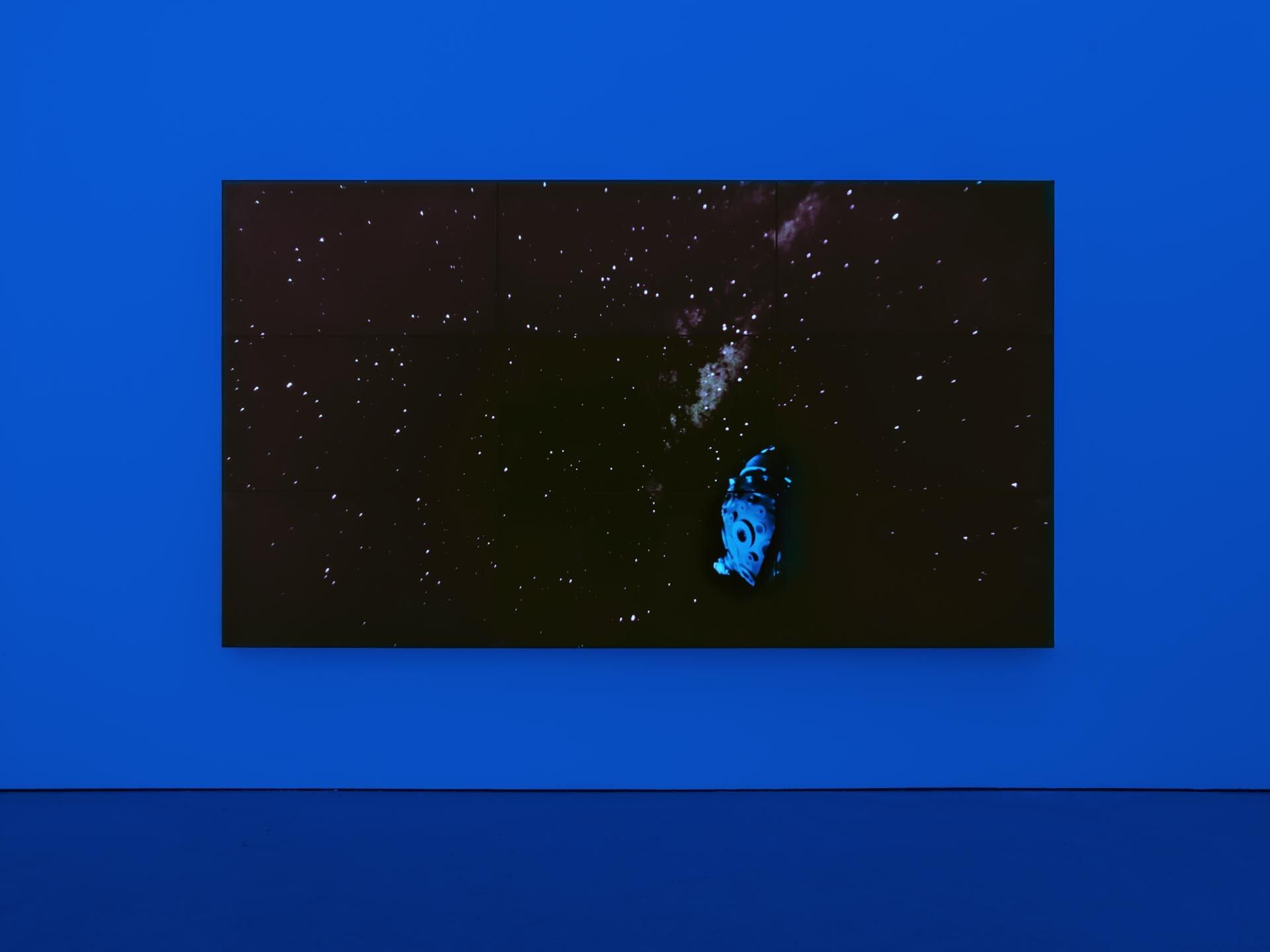 A 9-monitor video wall by Diana Thater, titled The Starry Messenger, dated 2014. 