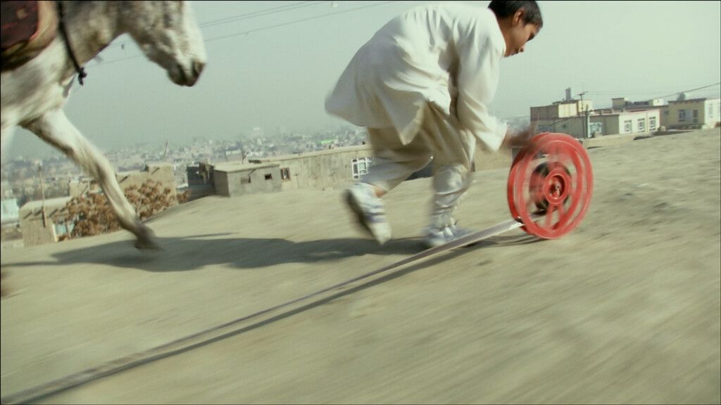 A film still from Francis Alÿs, titled REEL-UNREEL, dated 2011