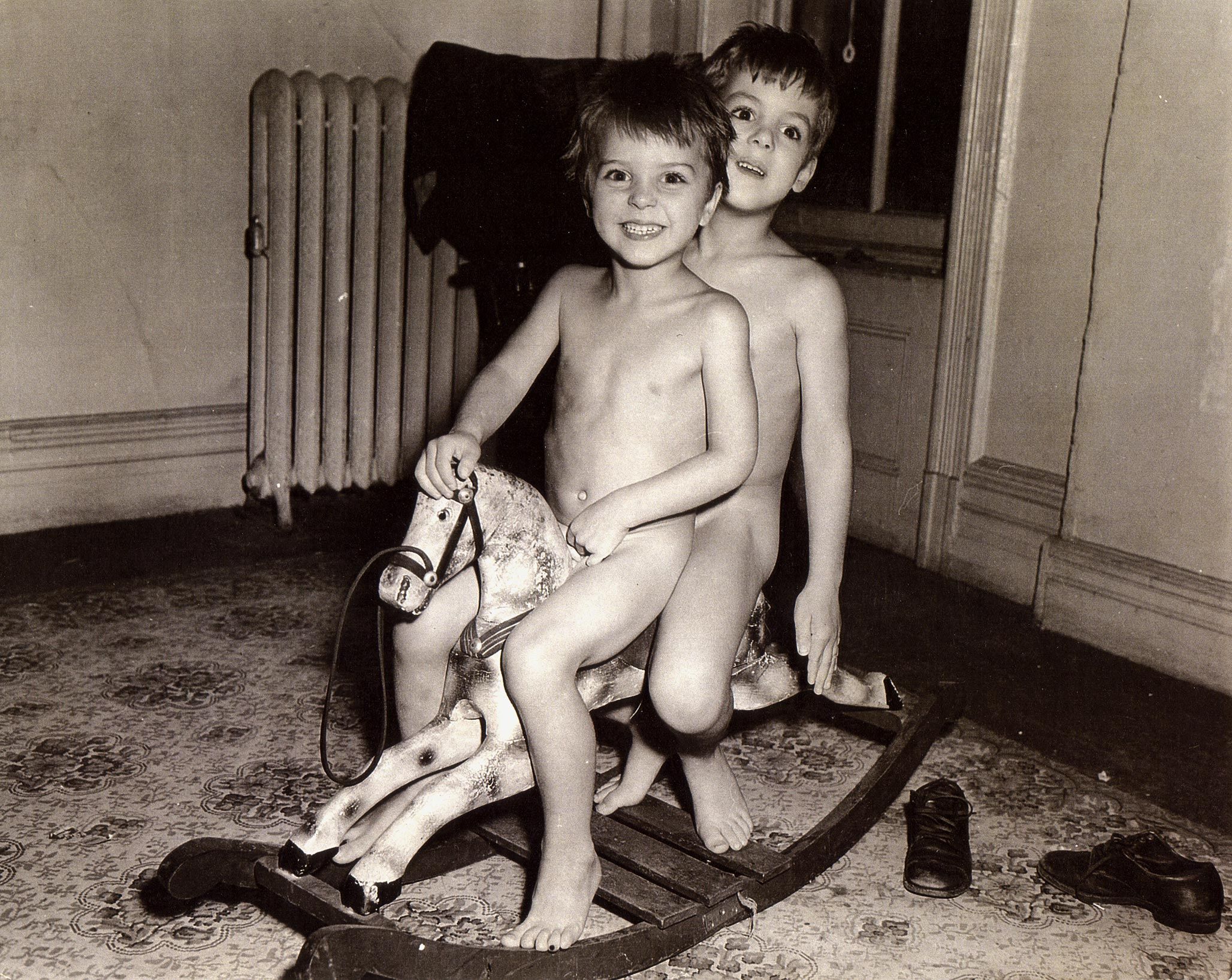 A photo of Alice Neel's sons Hartley and Richard on a rocking horse, in c. 1944.