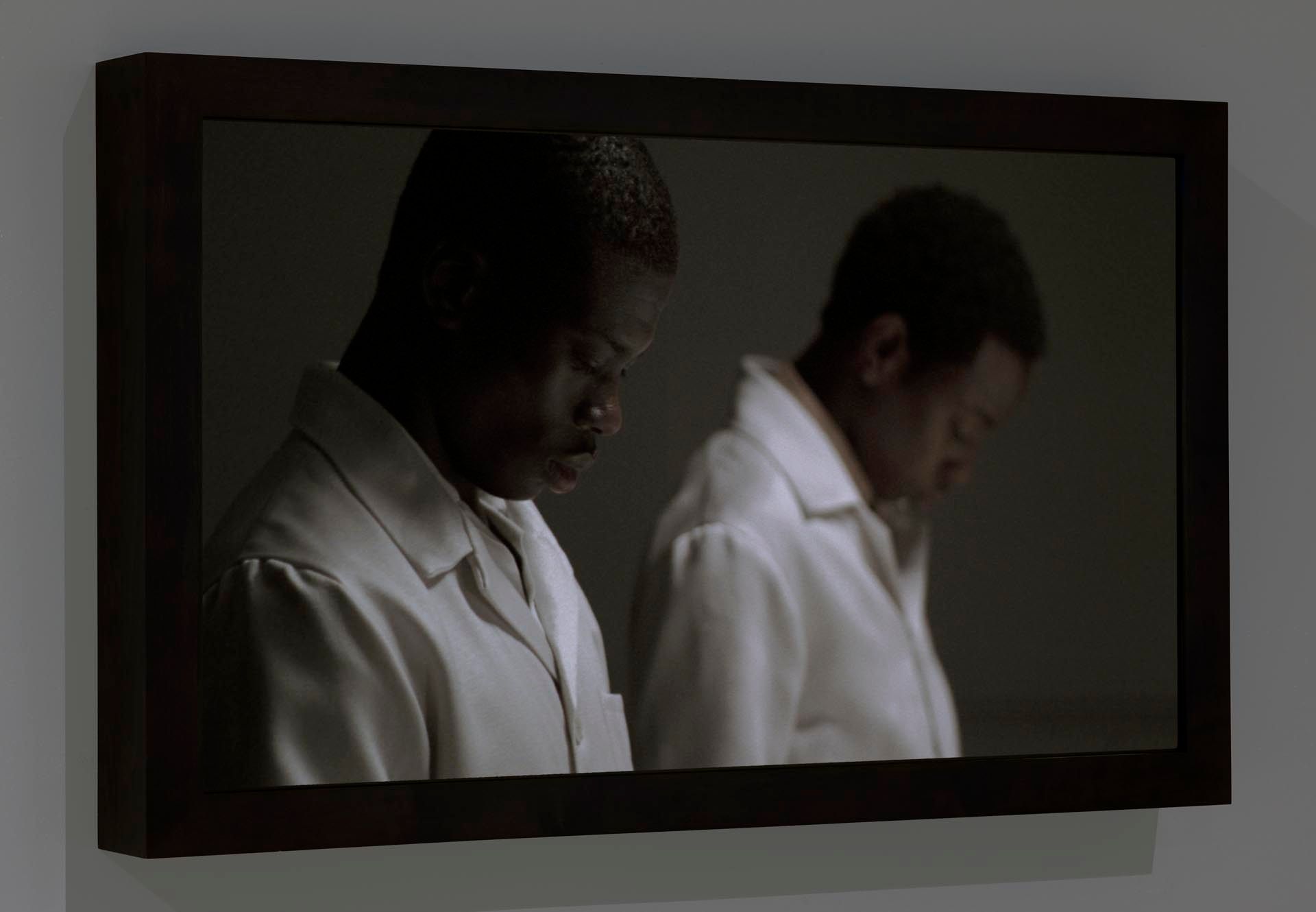 Still from a film by Michael Borremans, titled The Feeding, dated 2006.