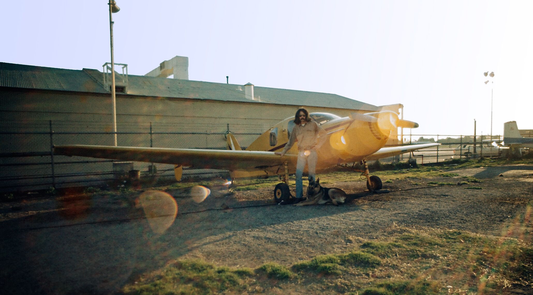 Doug Wheeler with Bellanca Cruisemaster and his German shepherd Zero, circa 1969