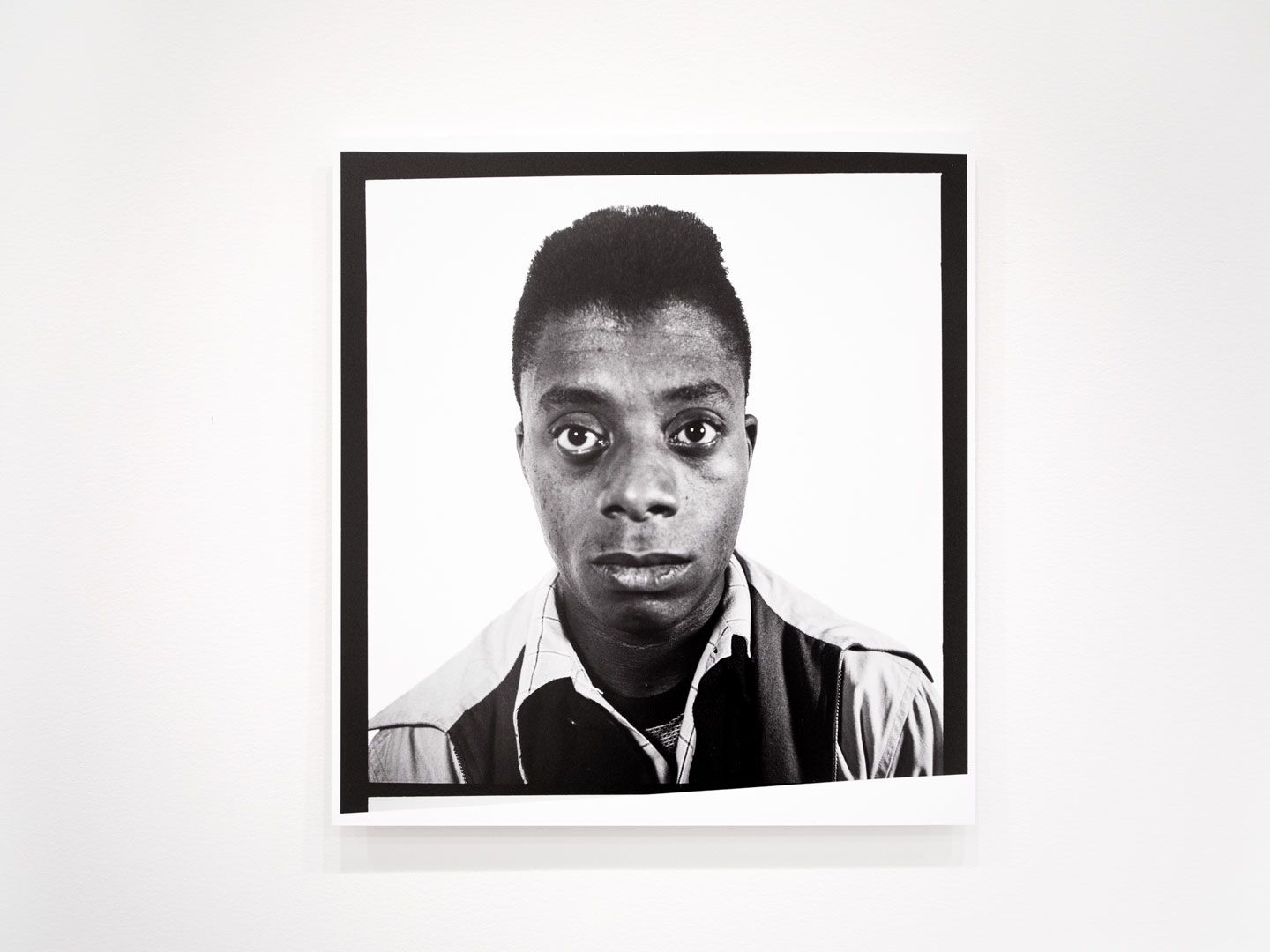 A reproduction of a photograph of James Baldwin by Richard Avedon, circa 1945.