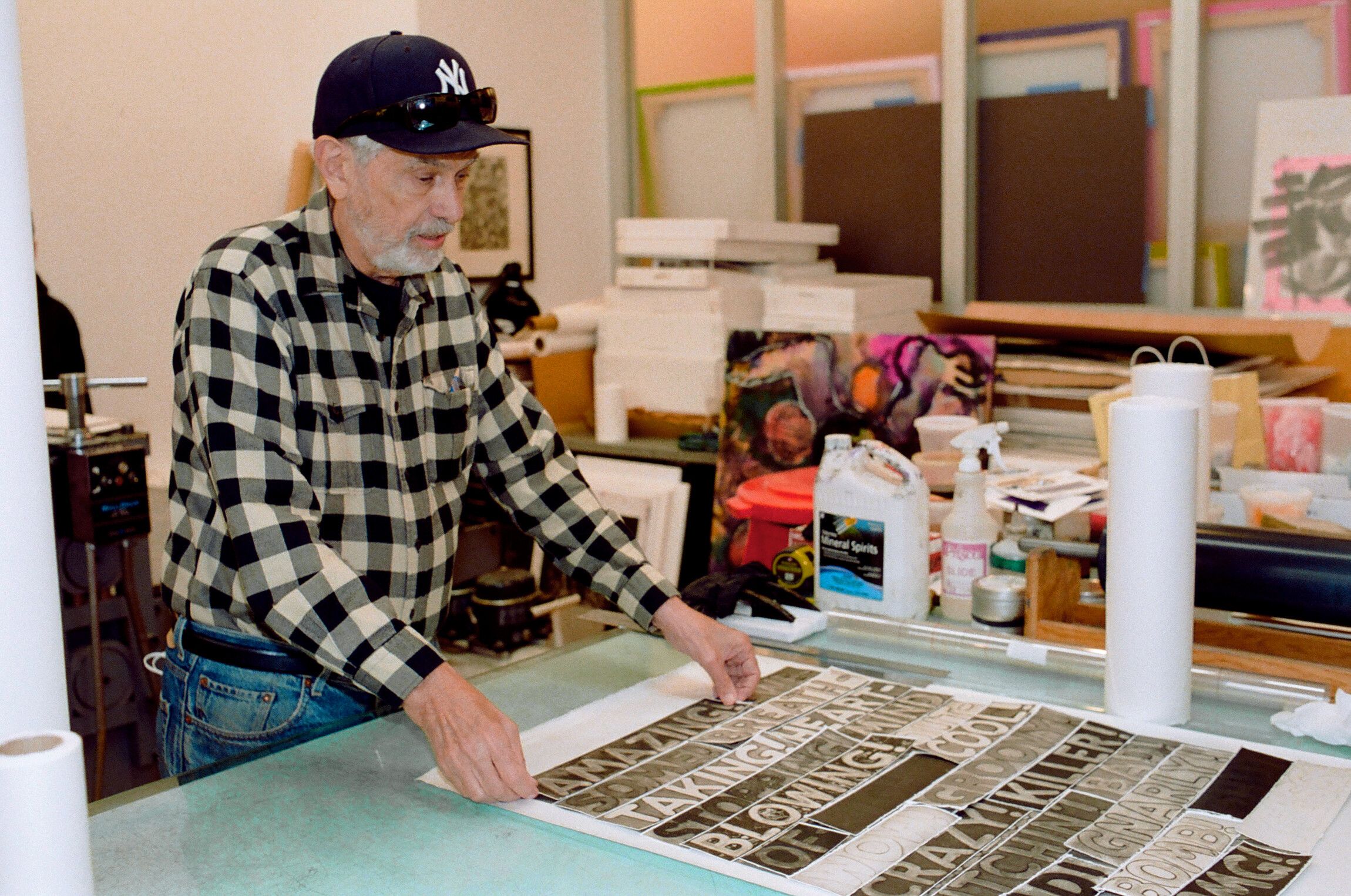 Artist handling print in studio, 2021