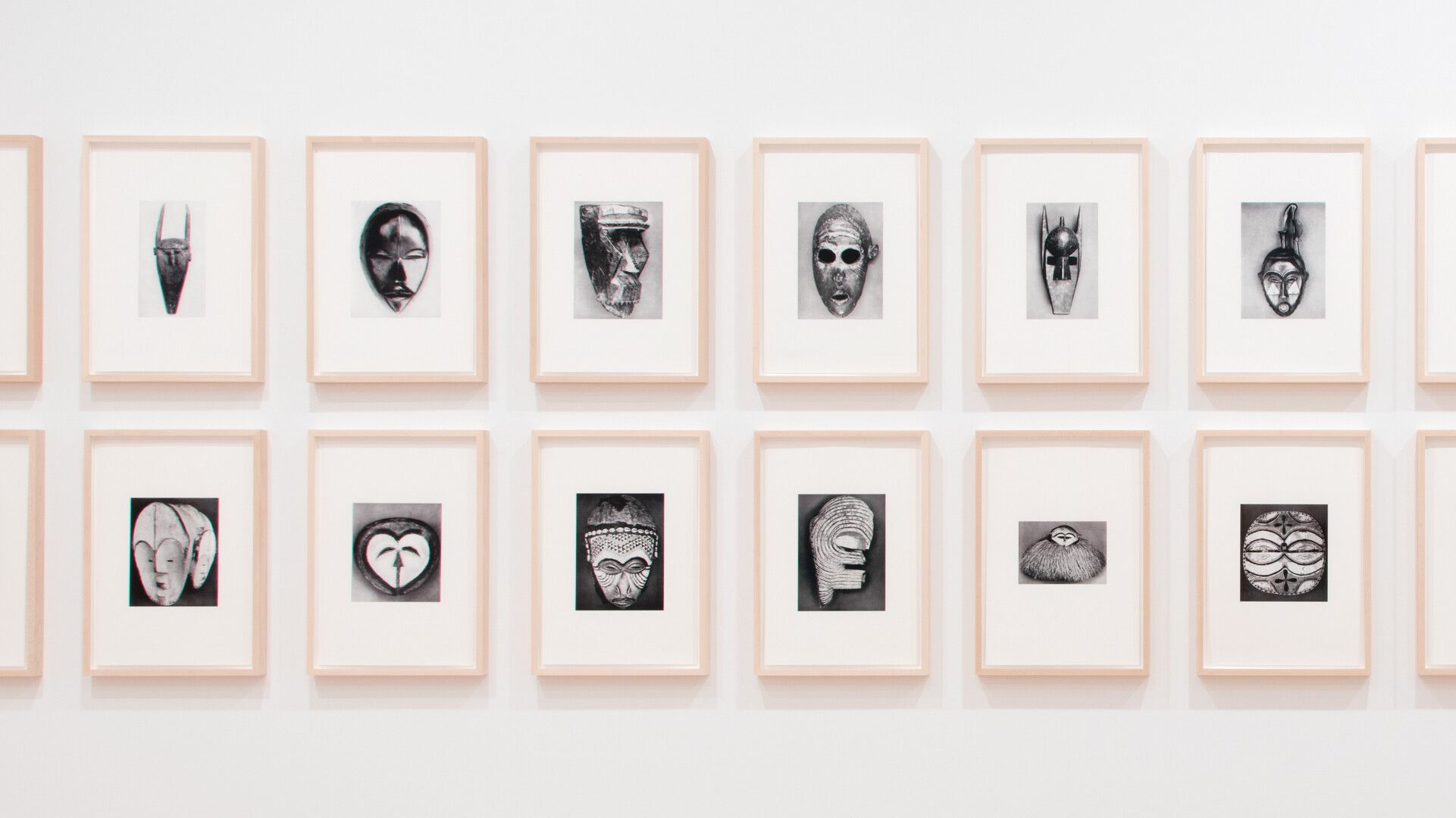 An installation view of part of a work by Sherrie Levine, titled African Masks After Walker Evans: 1–24, dated 2014.