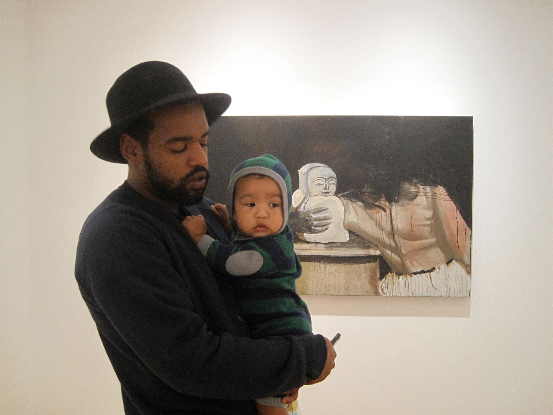 A photo of Noah Davis and his son Moses Davis at James Harris Gallery, Seattle, in 2010. Photo by Karon Davis.