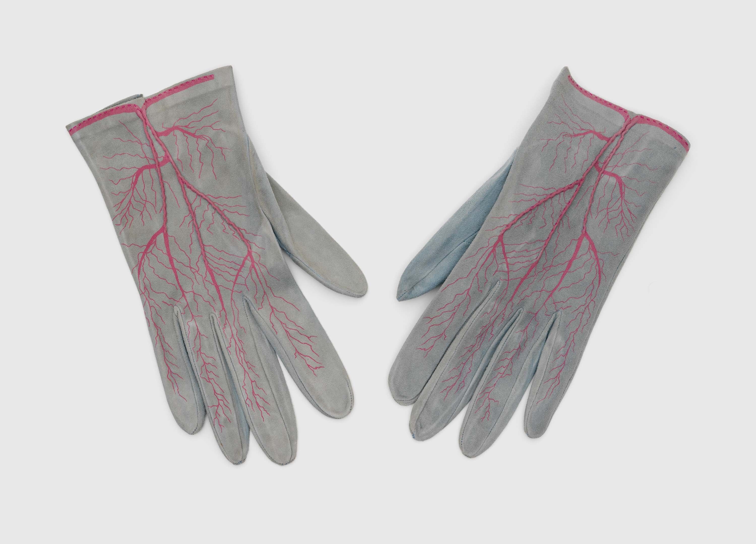 A textile by Meret Oppenheim, titled Glove, dated 1985.
