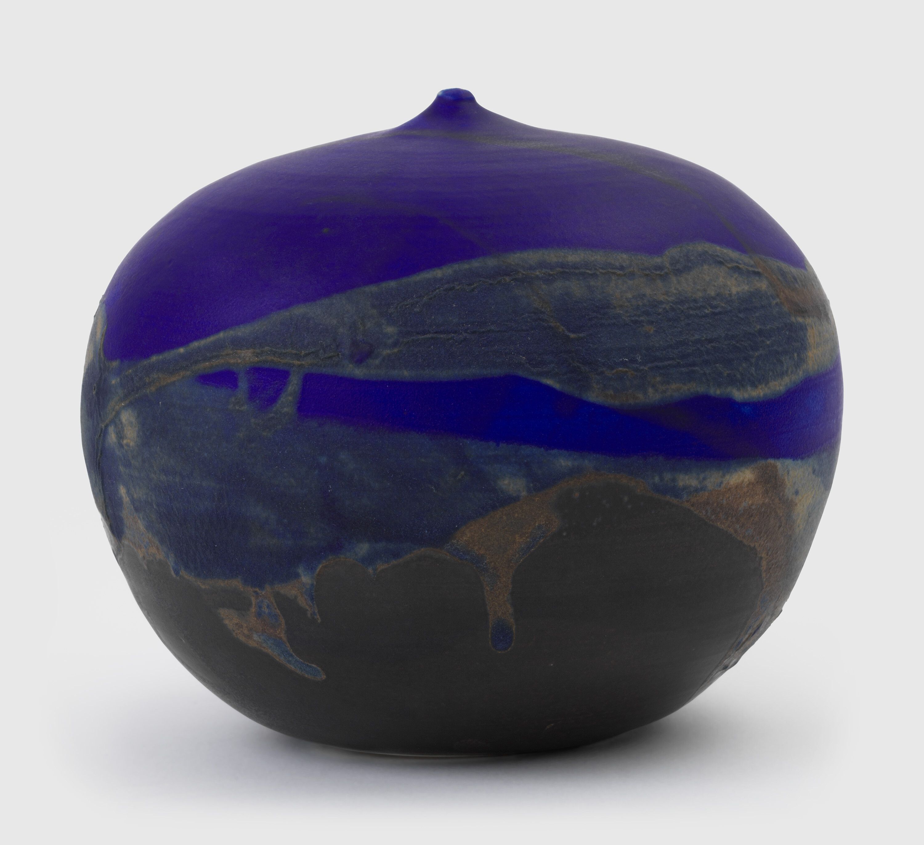 A sculpture by Toshiko Takaezu, titled ﻿Makaha Blue Closed Form, circa 1990.