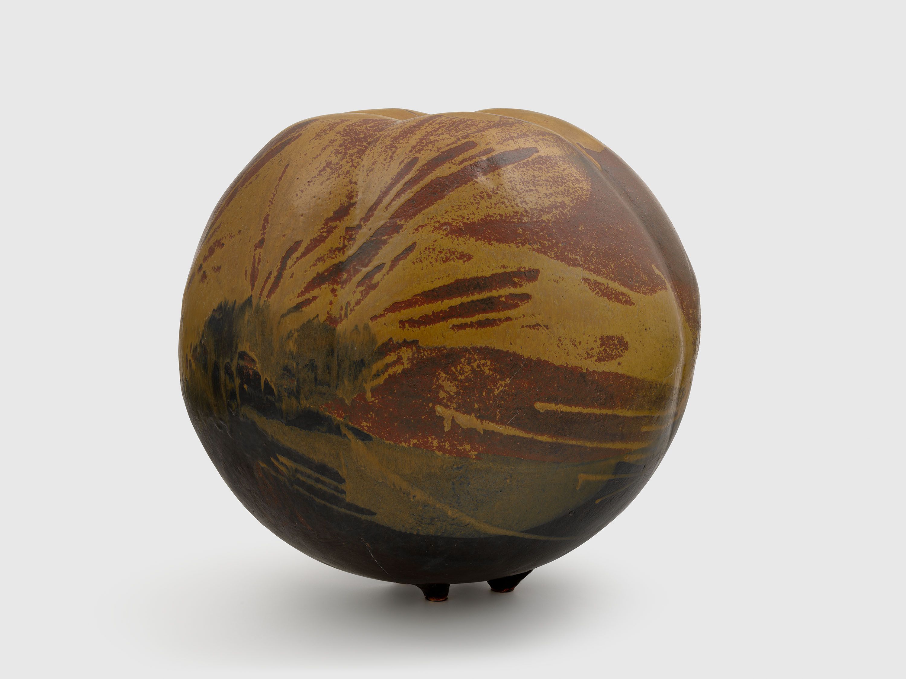 A sculpture by Toshiko Takaezu, titled ﻿“Persimmon” Moon, 1970 to 1989.