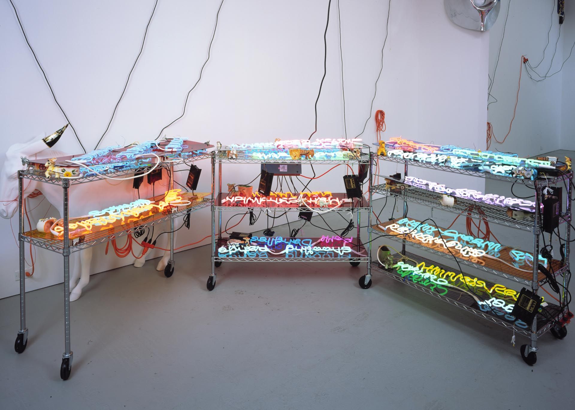 A sculpture by Jason Rhoades, titled Shelf (Mutton Chops) with Unpainted Donkey, dated 2003.