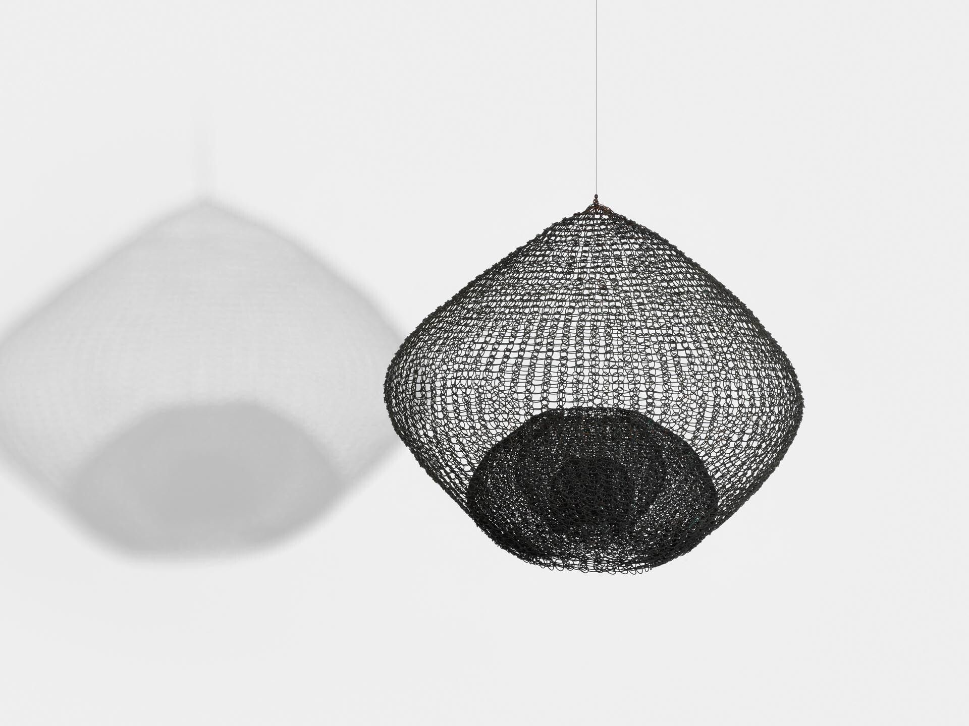 A sculpture by Ruth Asawa, titled Untitled (S.752, Hanging, Single Lobe, Five-Layered, Continuous Form Within a Form), dated circa 1950 to 1959.