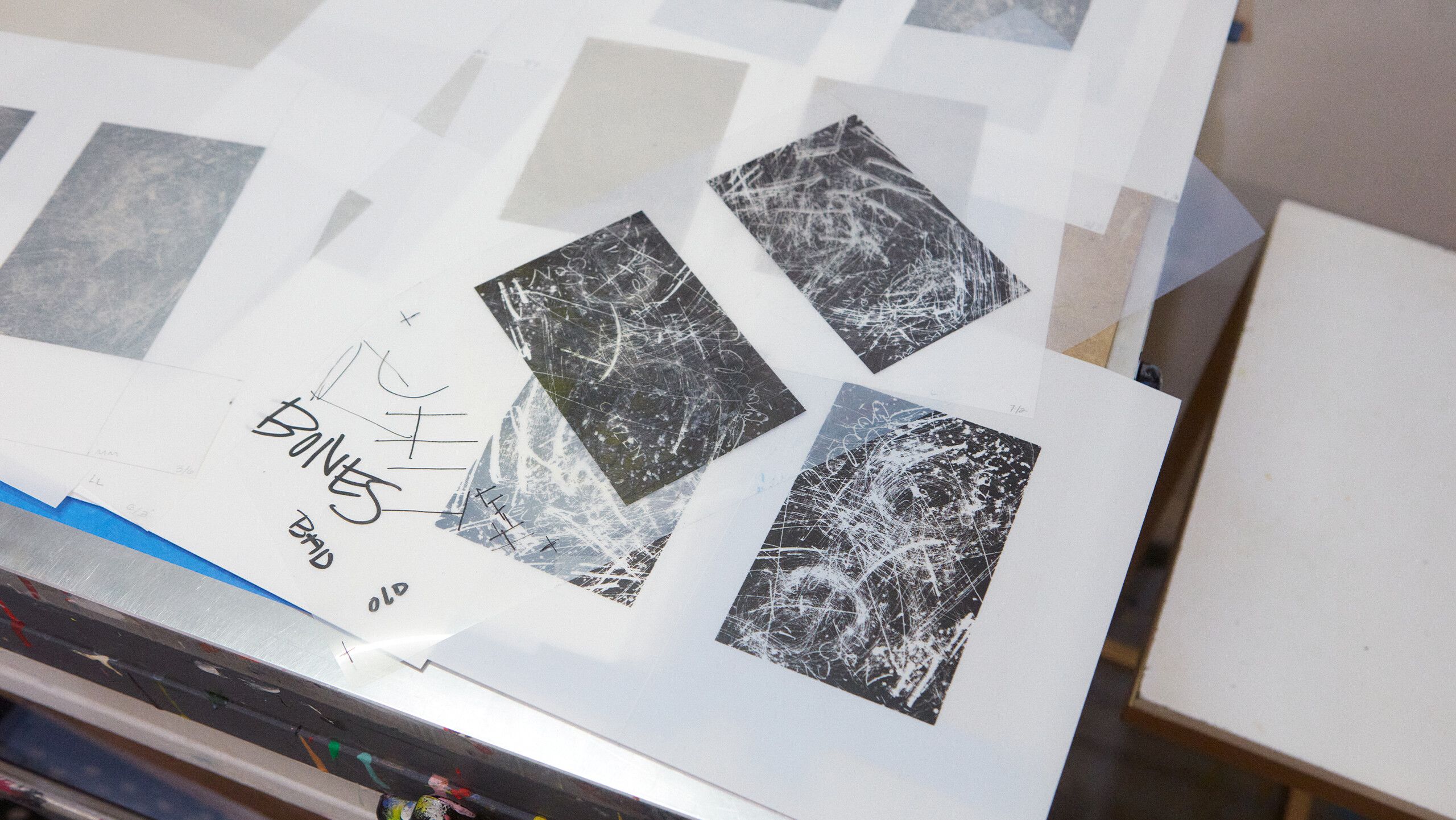 A photograph of detail of films and proofs for Gale’s print by Rafael Rios, dated 2022.