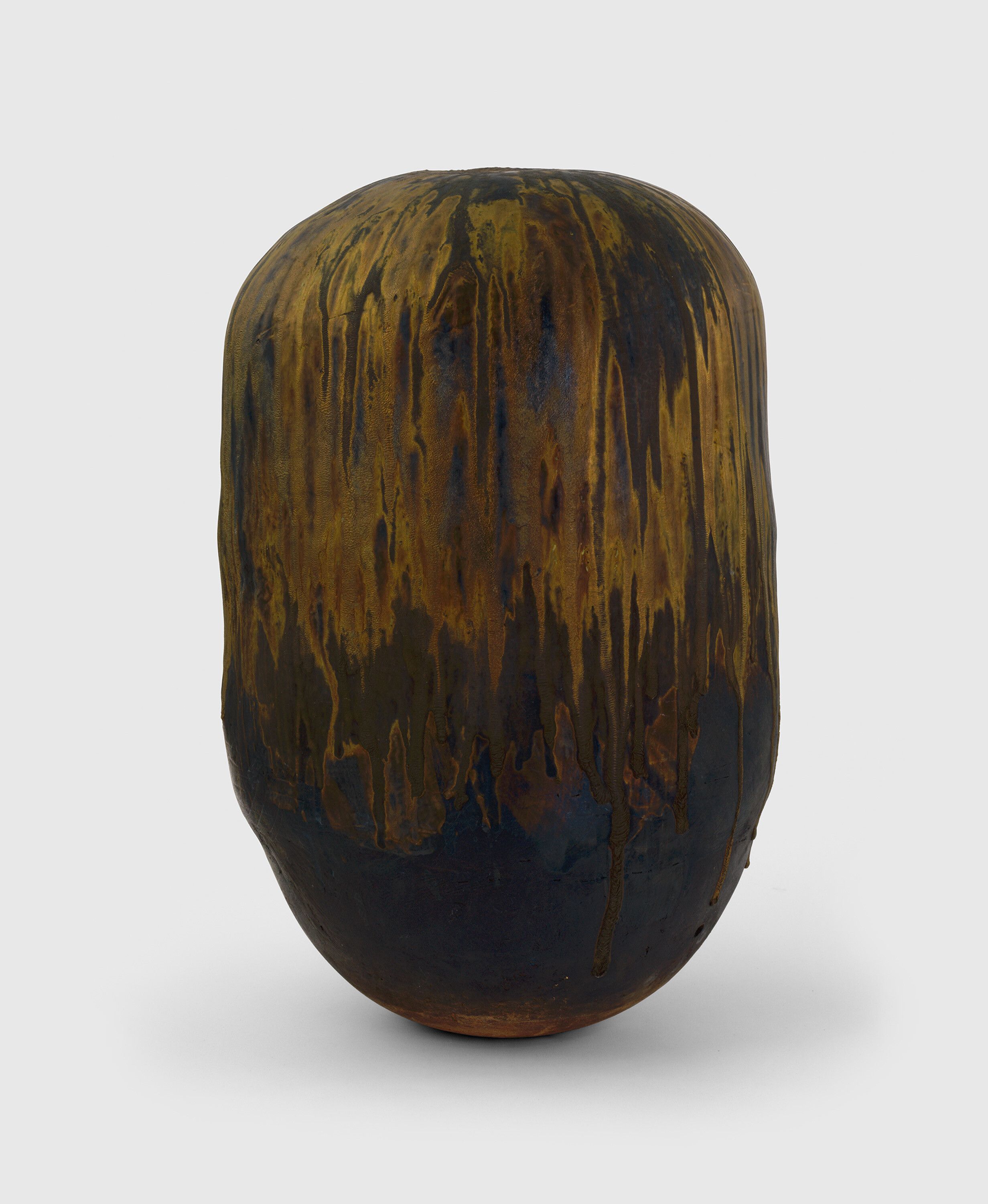 A sculpture by Toshiko Takaezu, titled Alchemy Gold Closed Form, circa 1990 to 1993.