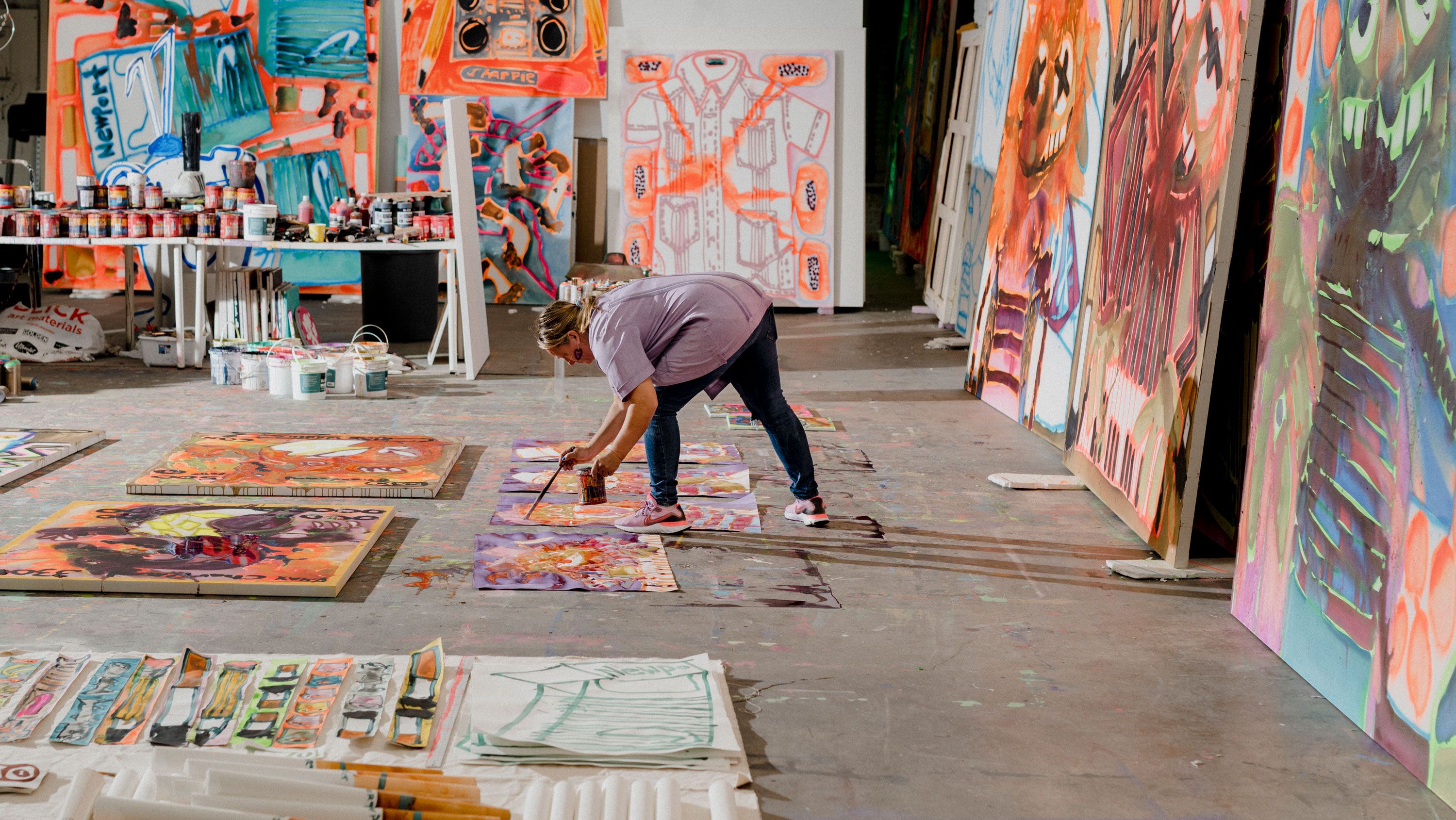 Bernhardt works on numerous paintings at the same time, moving quickly from canvas to canvas.