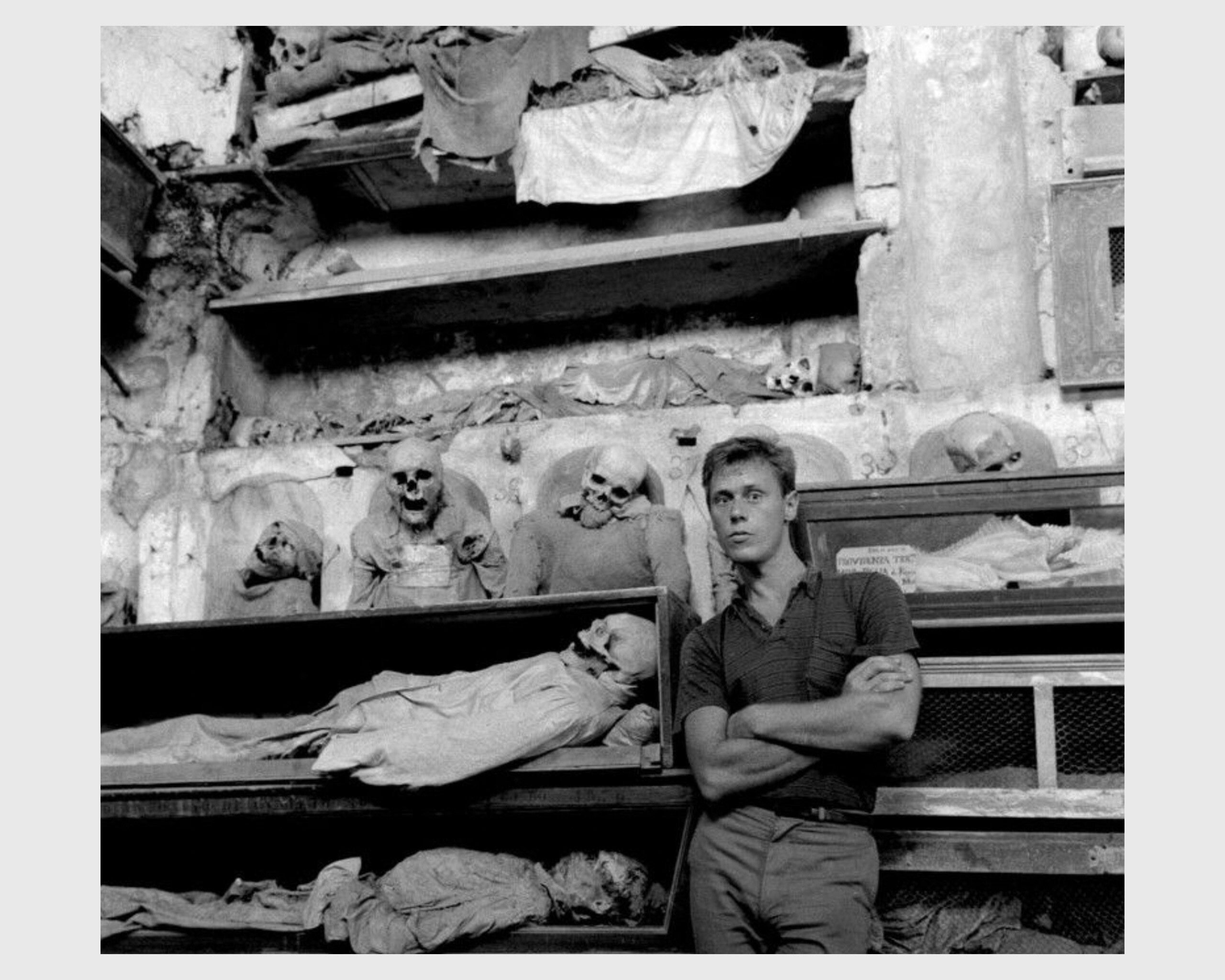 A photograph by Peter HujarPaul Thek in the Capuchin Catacombs, Palermo, 1963.
