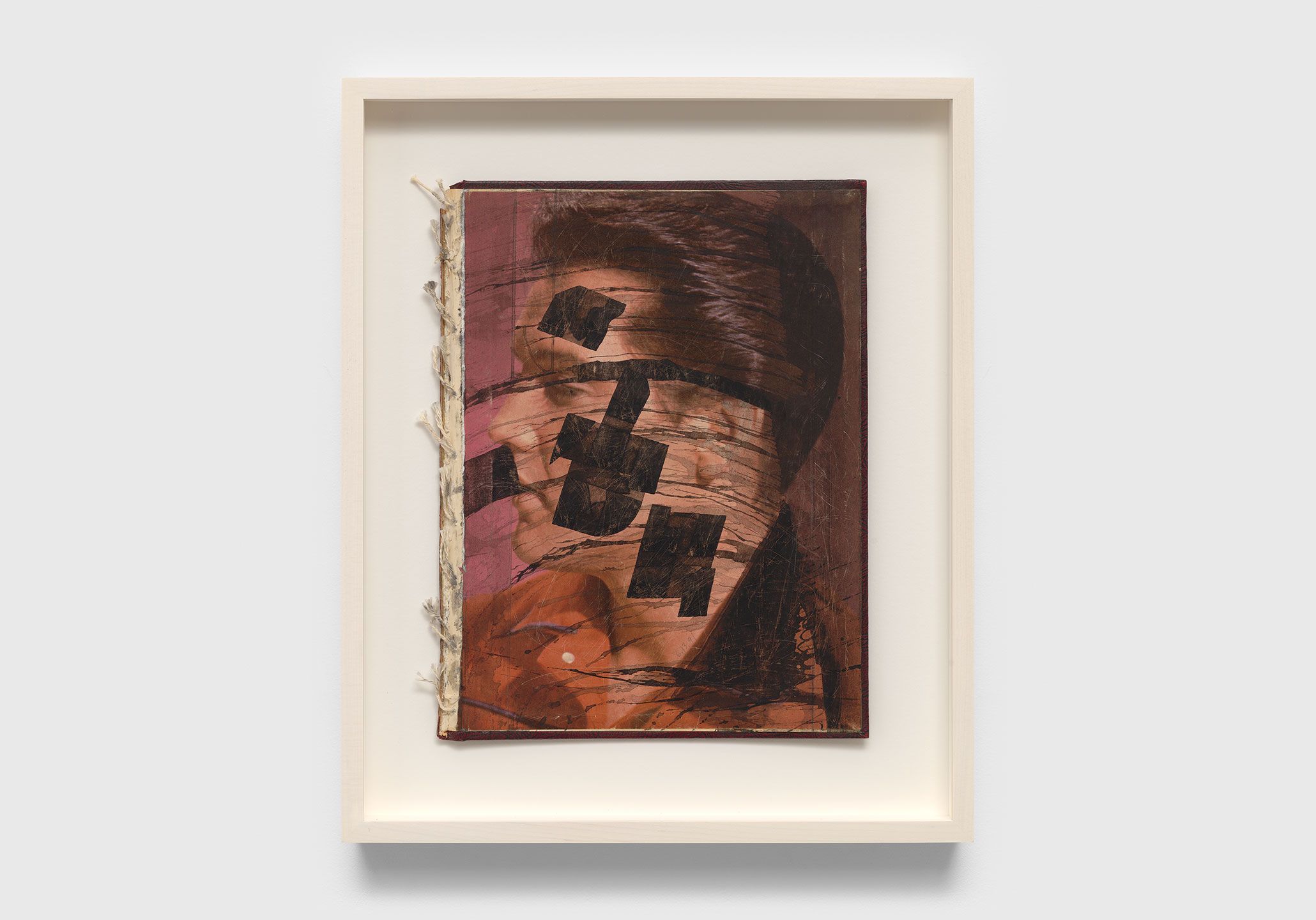 A collage on leather book cover by Ray Johnson, titled Untitled (Elvis book), dated 1991.