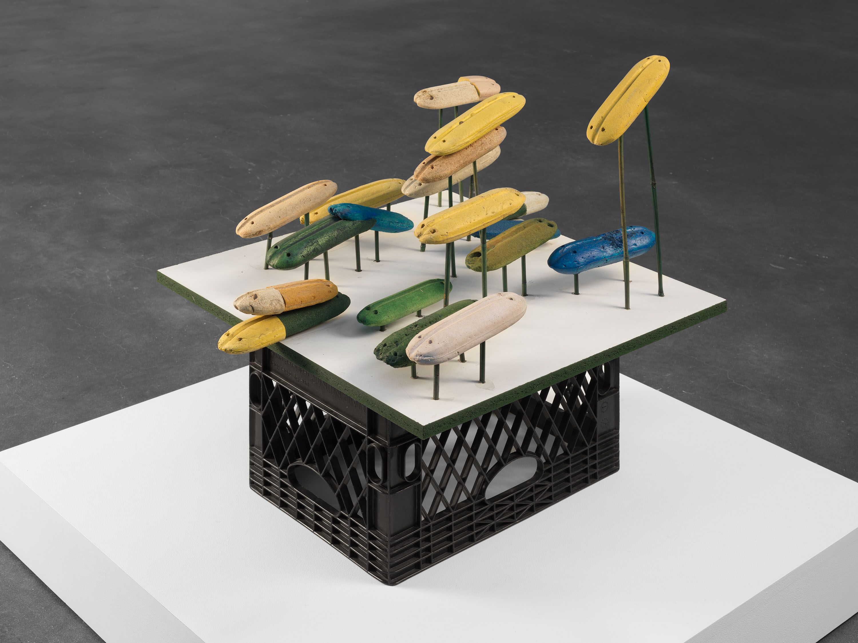 A sculpture by Al Taylor, titled Floaters (Pill Heads), dated1998.