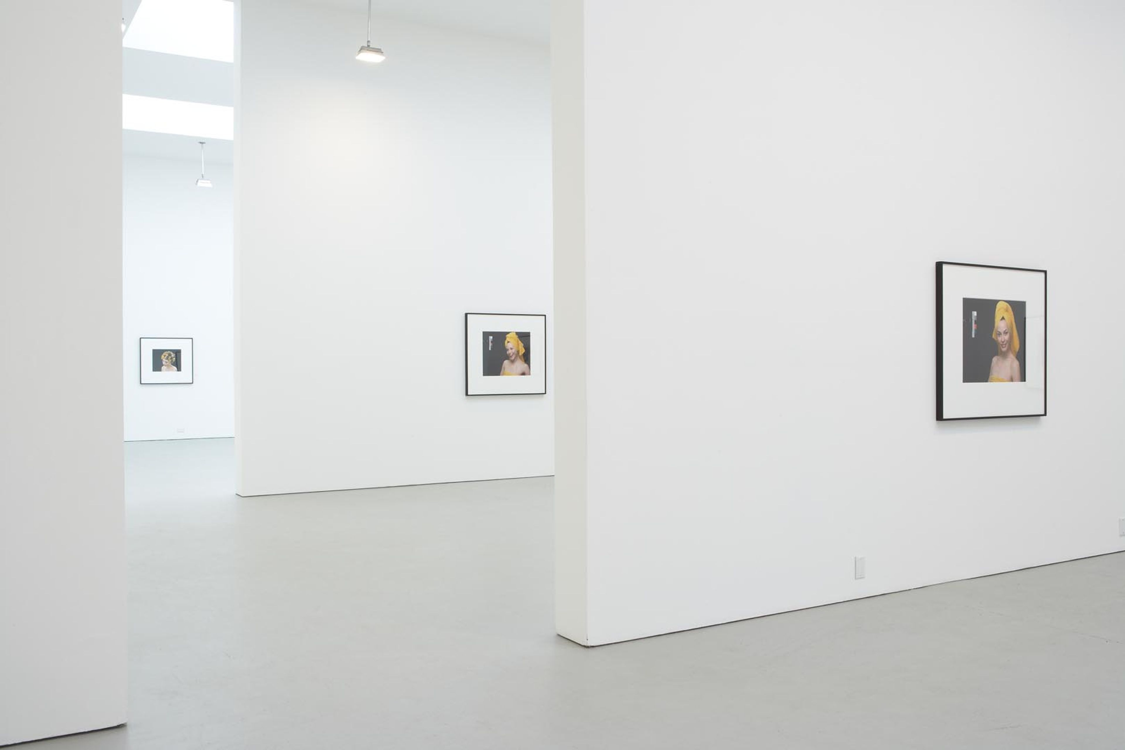 Installation view of the exhibition Christopher Williams: For Example: Dix-Huit Leçons Sur La Société Industrielle (Revision 4), at David Zwirner in New York, dated 2006. 